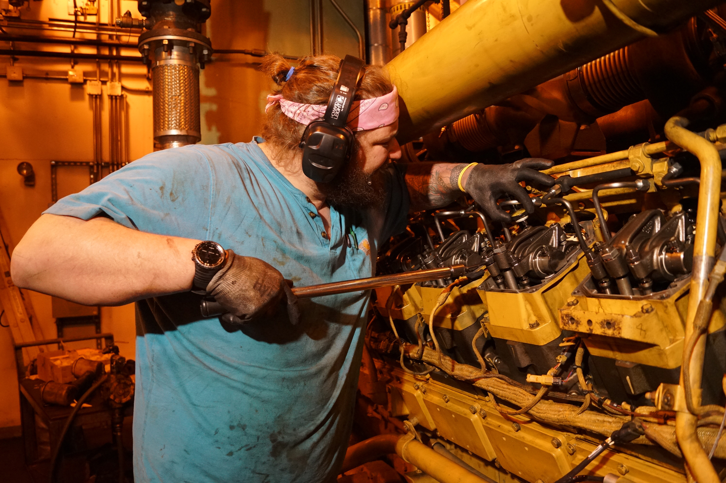 A mechanic works on power plant generators.