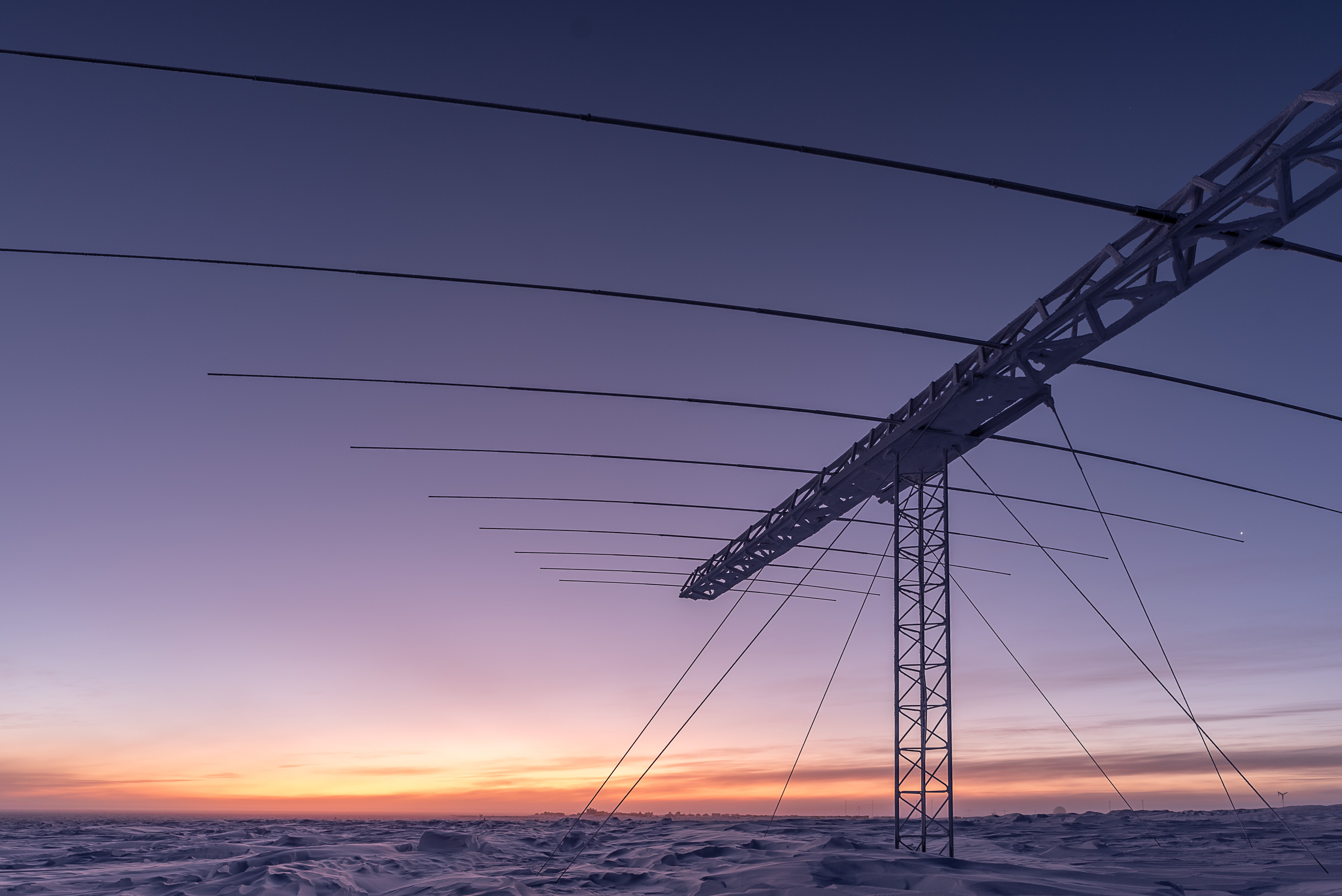 A view of an antenna at sunrise.