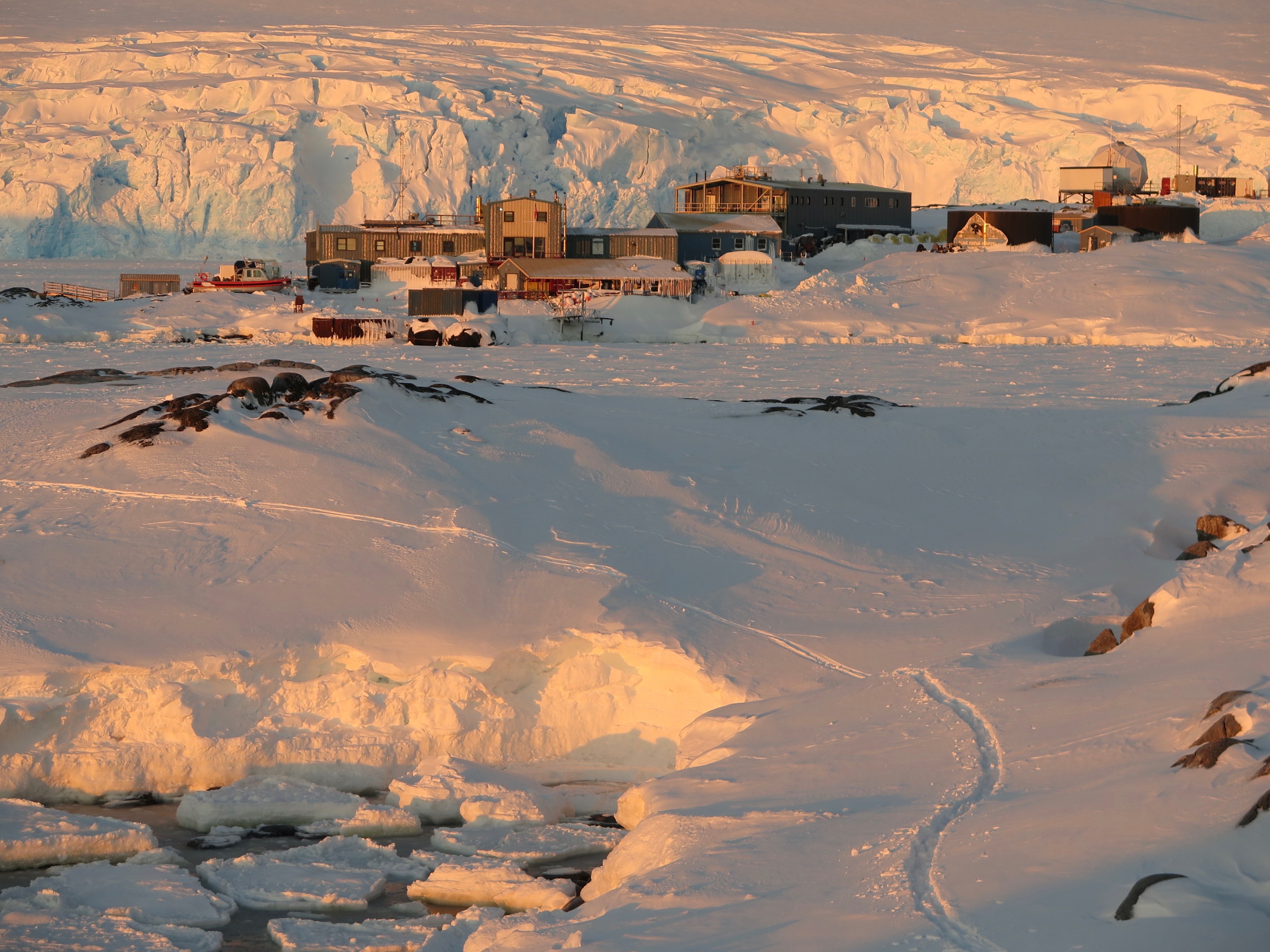 Several buildings on snow-covered ground.