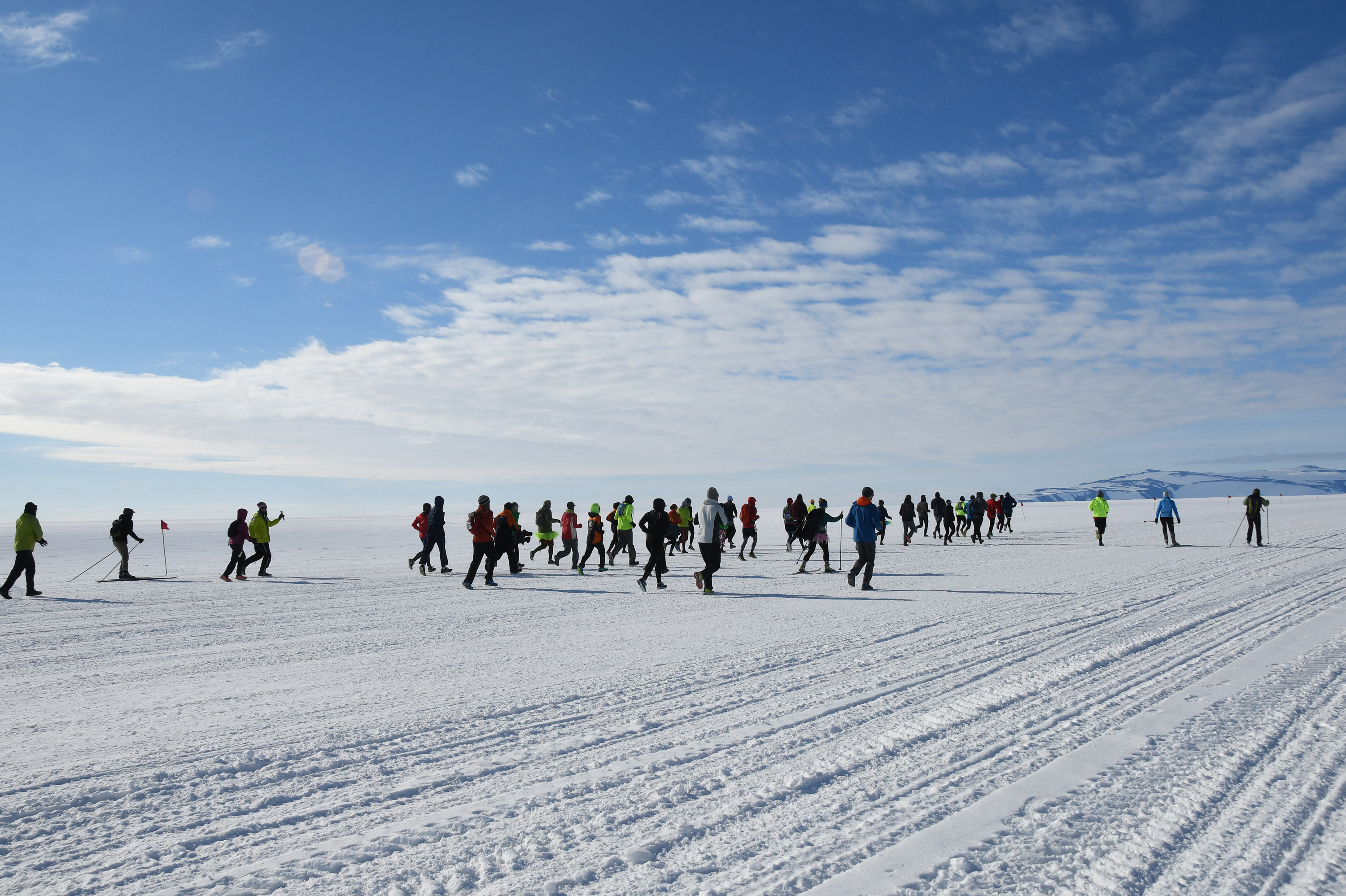 People running on snow.