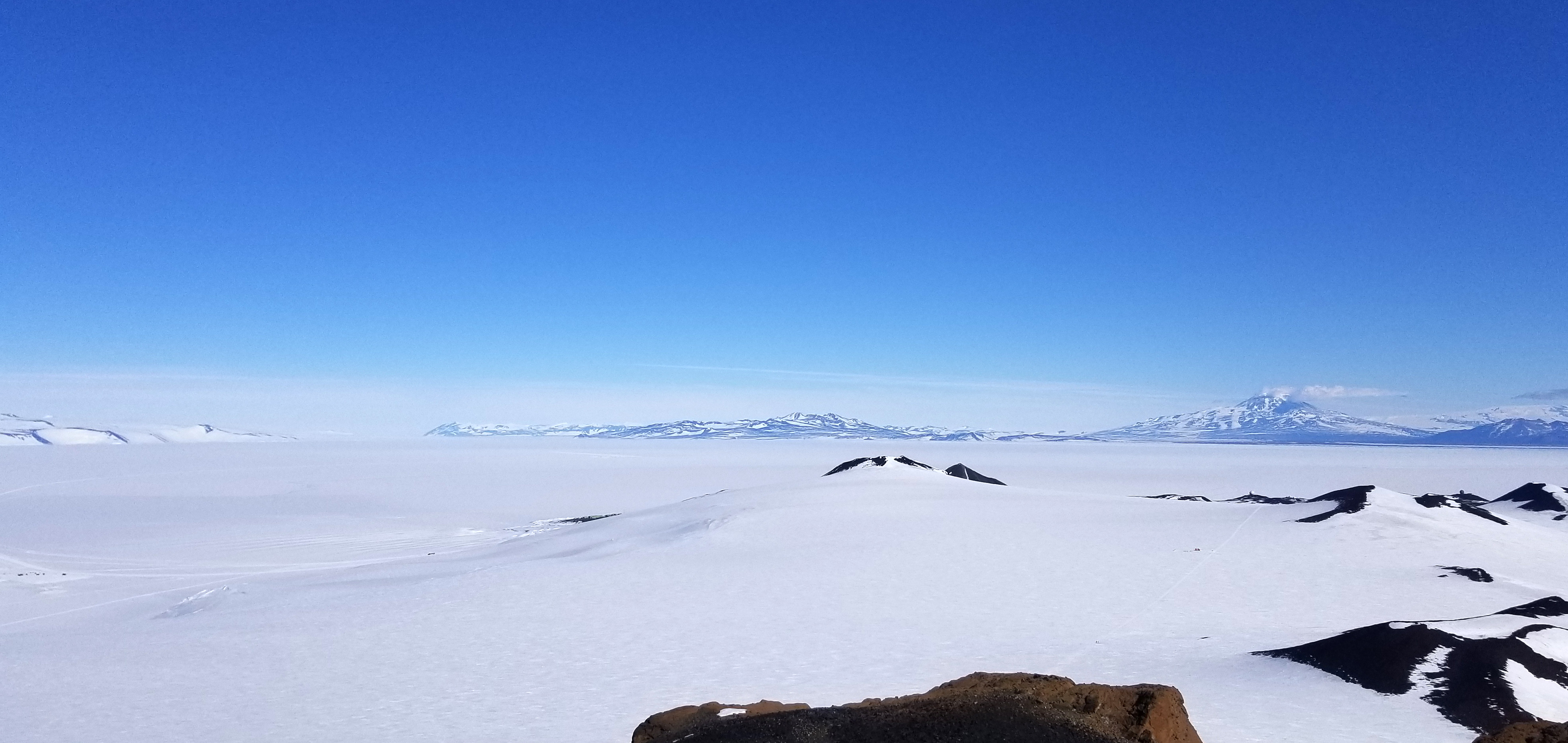 Rock showing through the snow in a winter landscape.