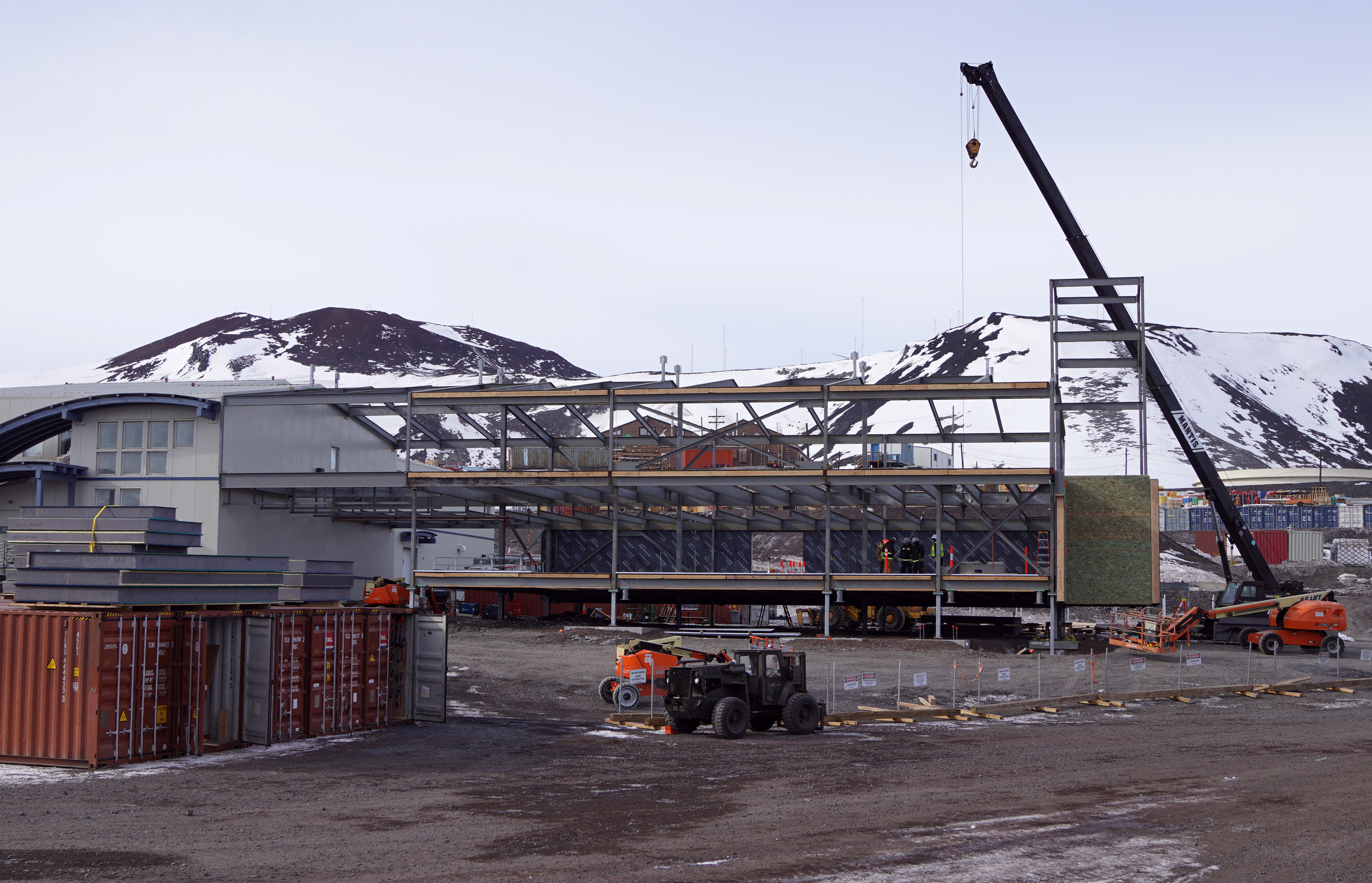 A steel beam building under construction.