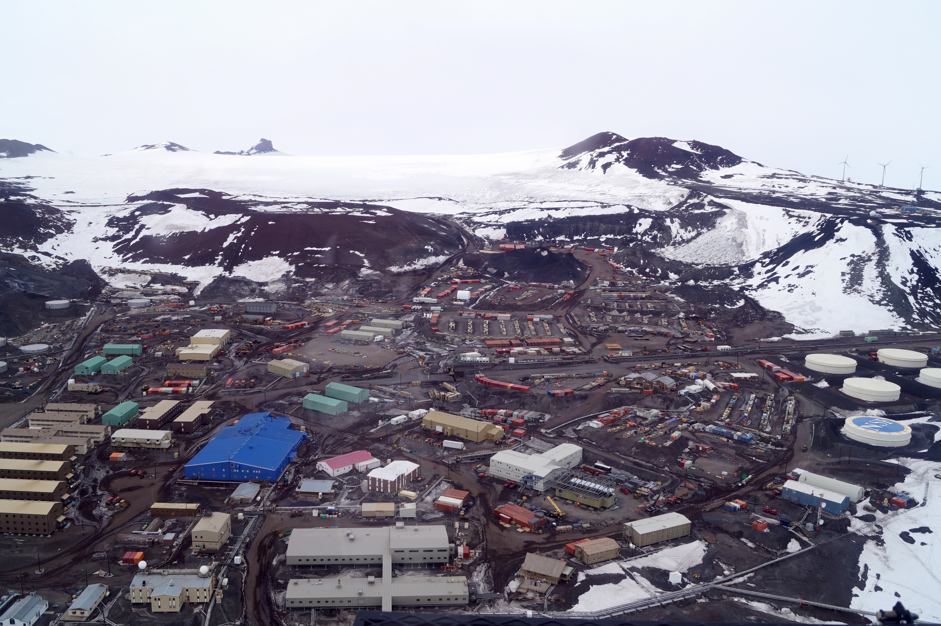 A grouping of buildings surrounded by snow.