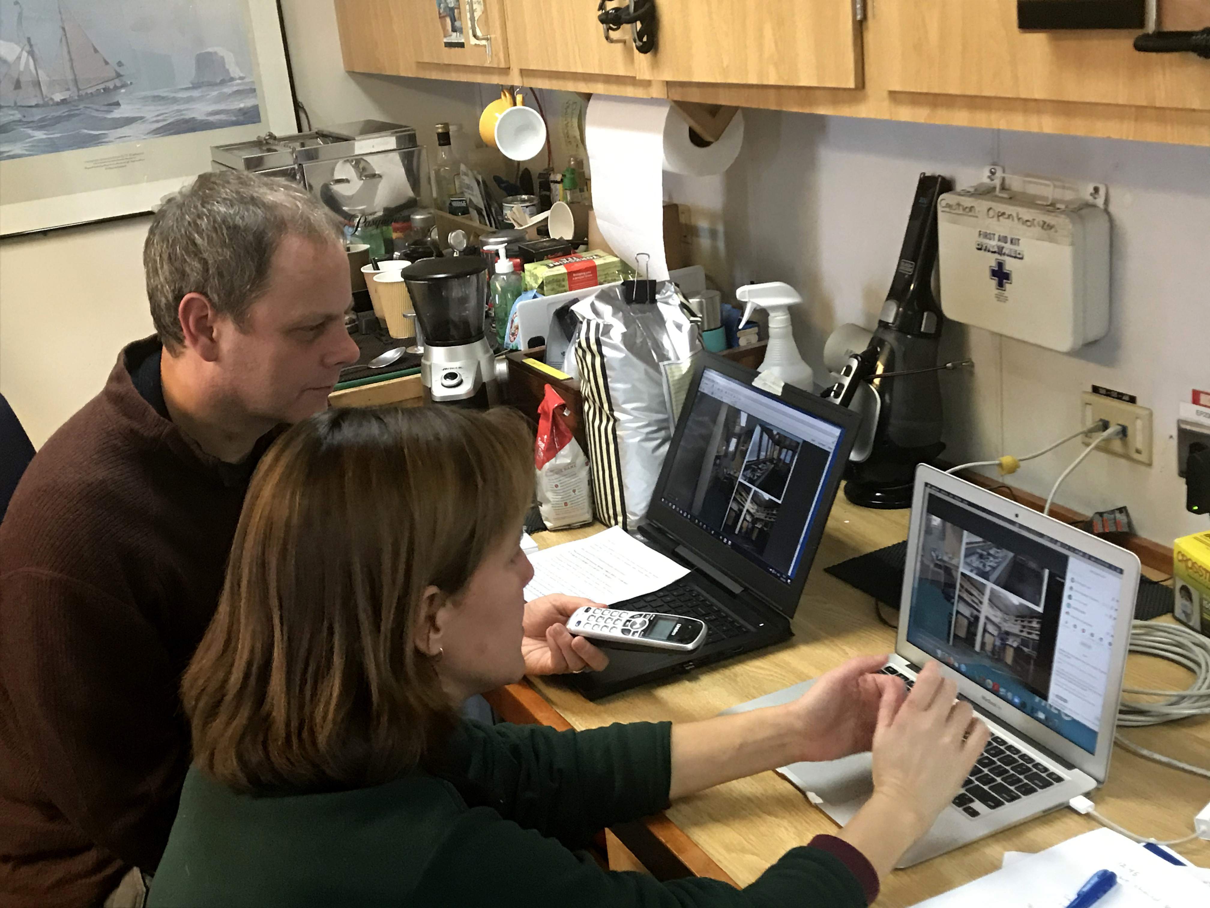 Two people using laptop computers.