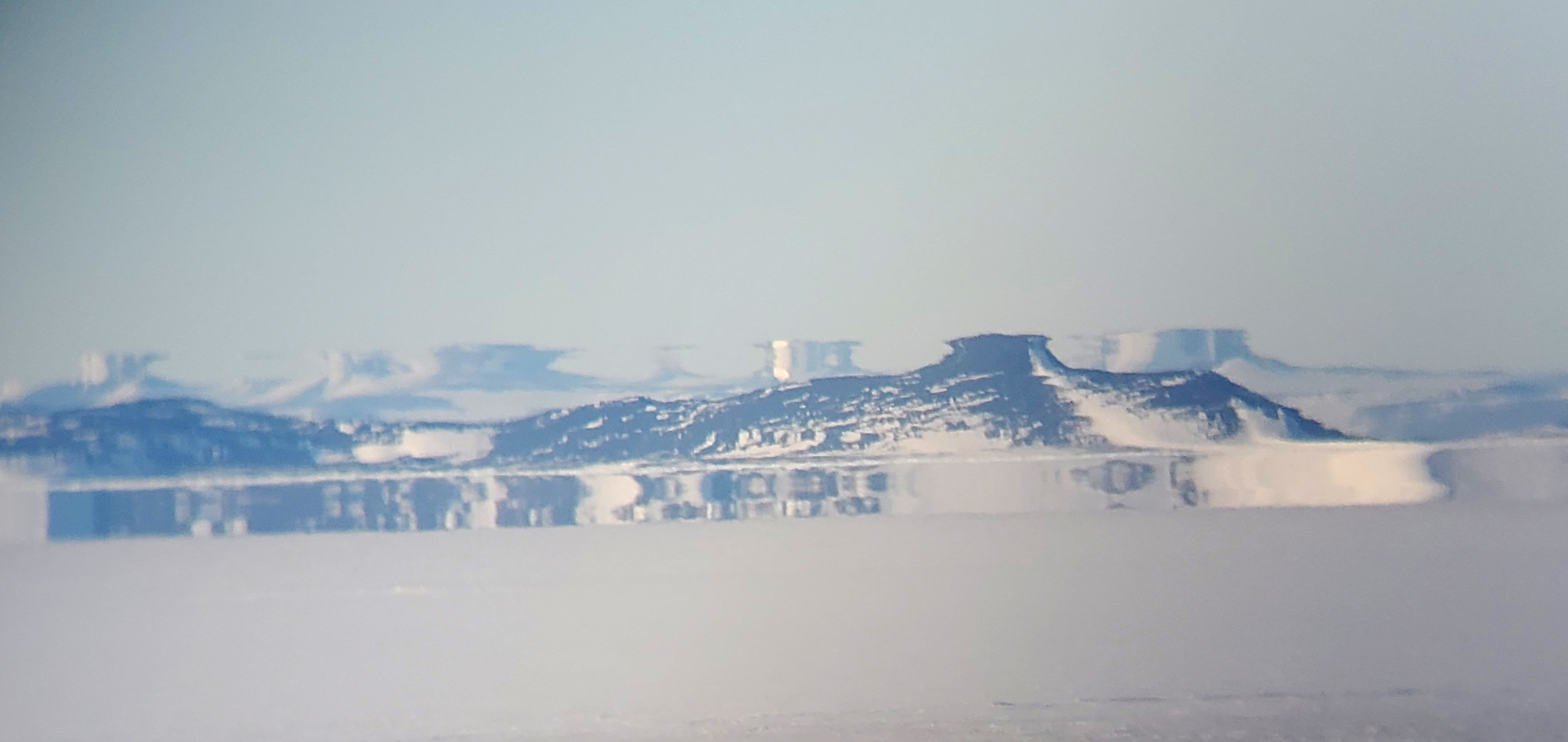 A distorted image of distant hills.