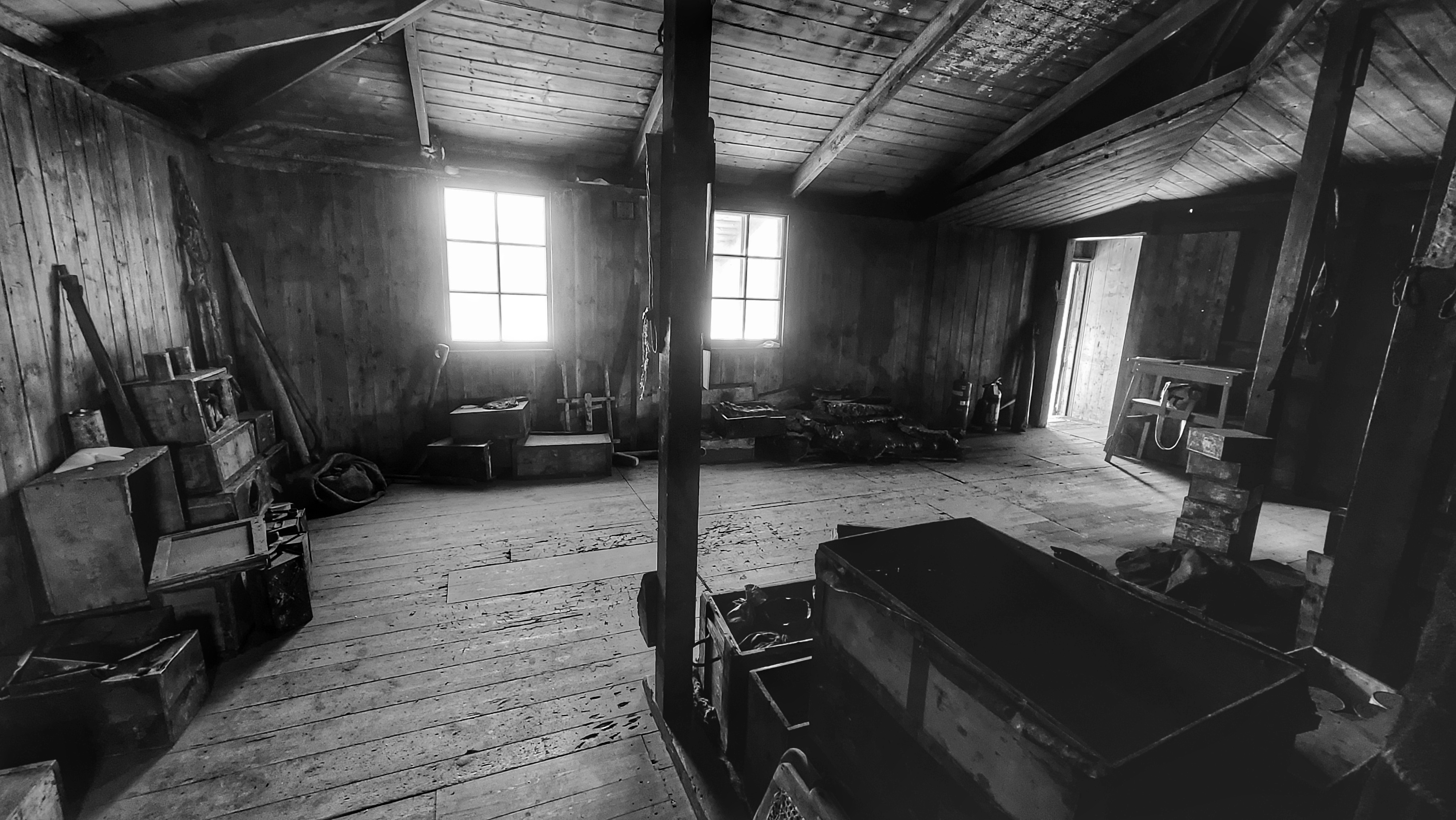 A black and white photo inside a small room.