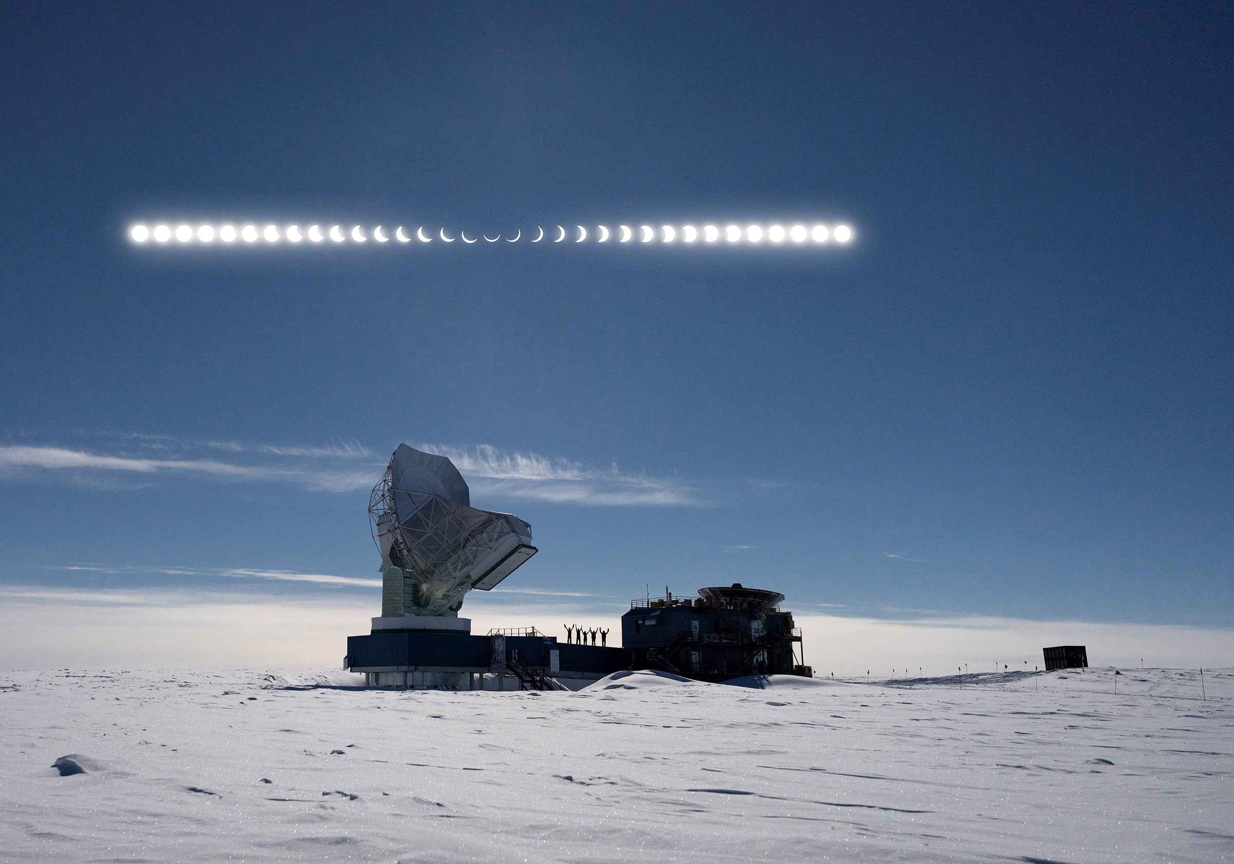A line of sun images in the sky above a large telescope.