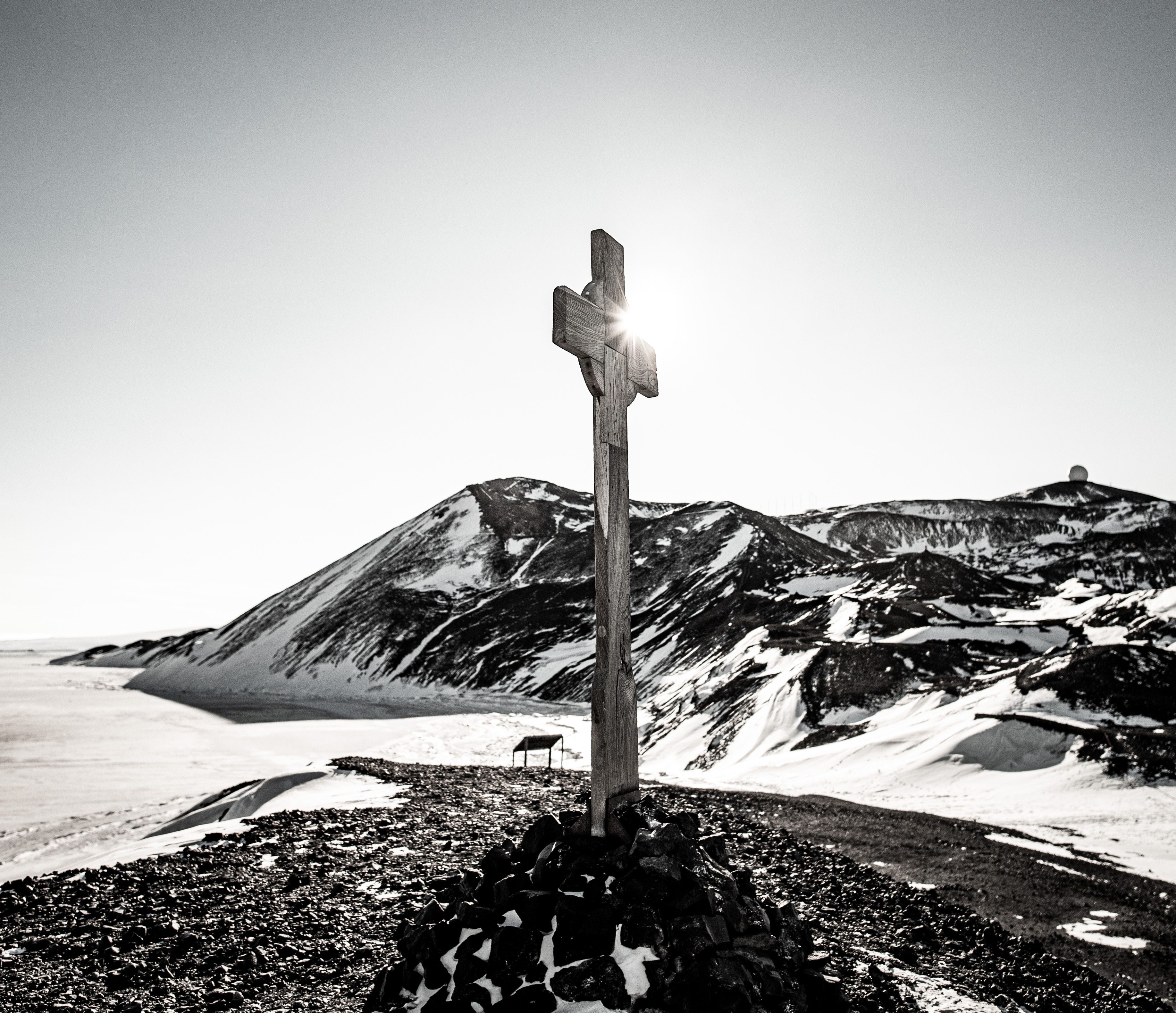 A black and white photo of a large wooden cross.