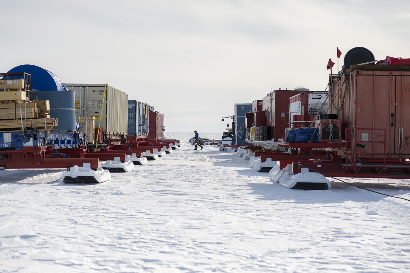 Two columns of sleds loaded with cargo for South Pole traverse