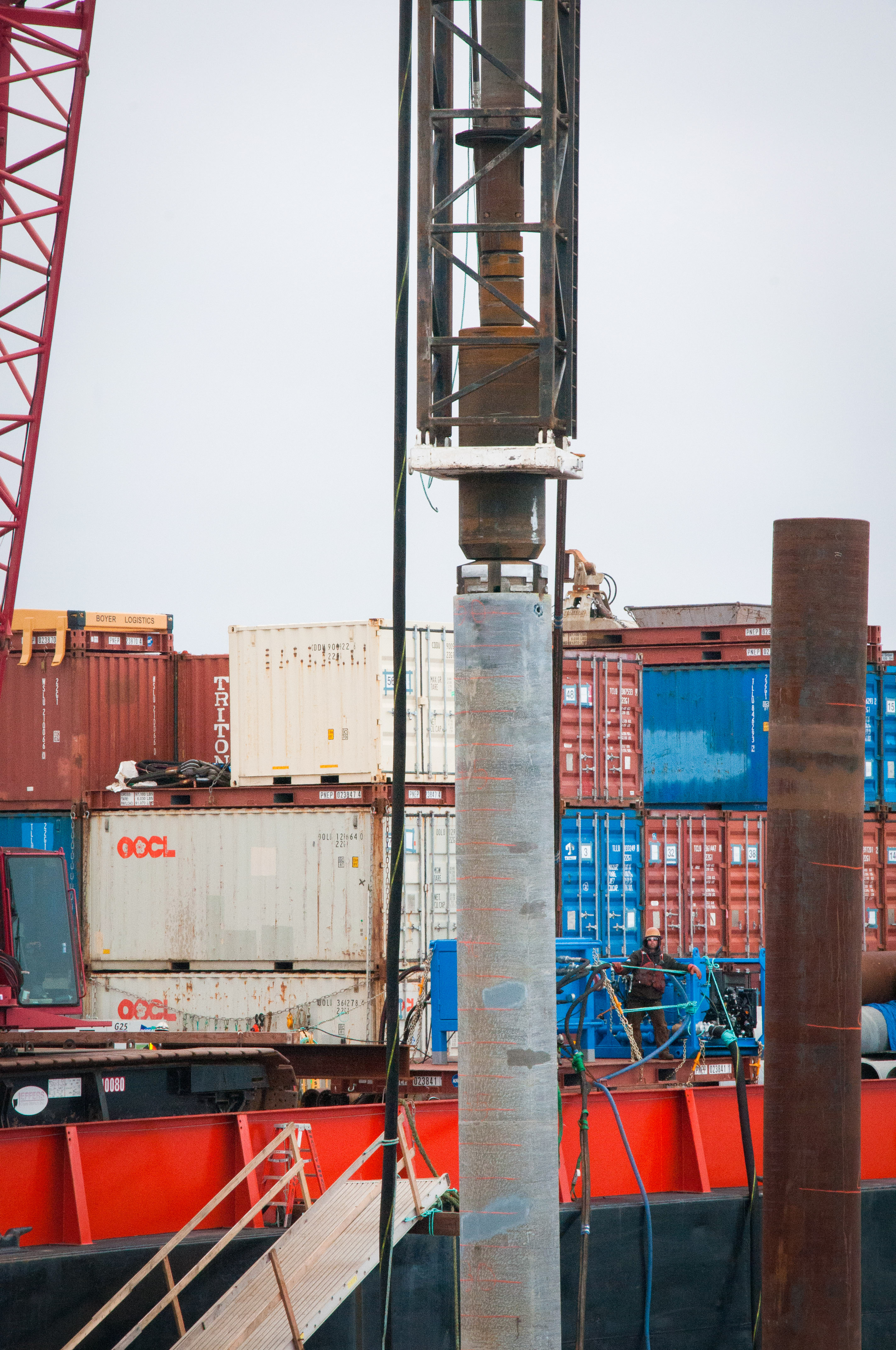 A steel pylon being driven into position. 