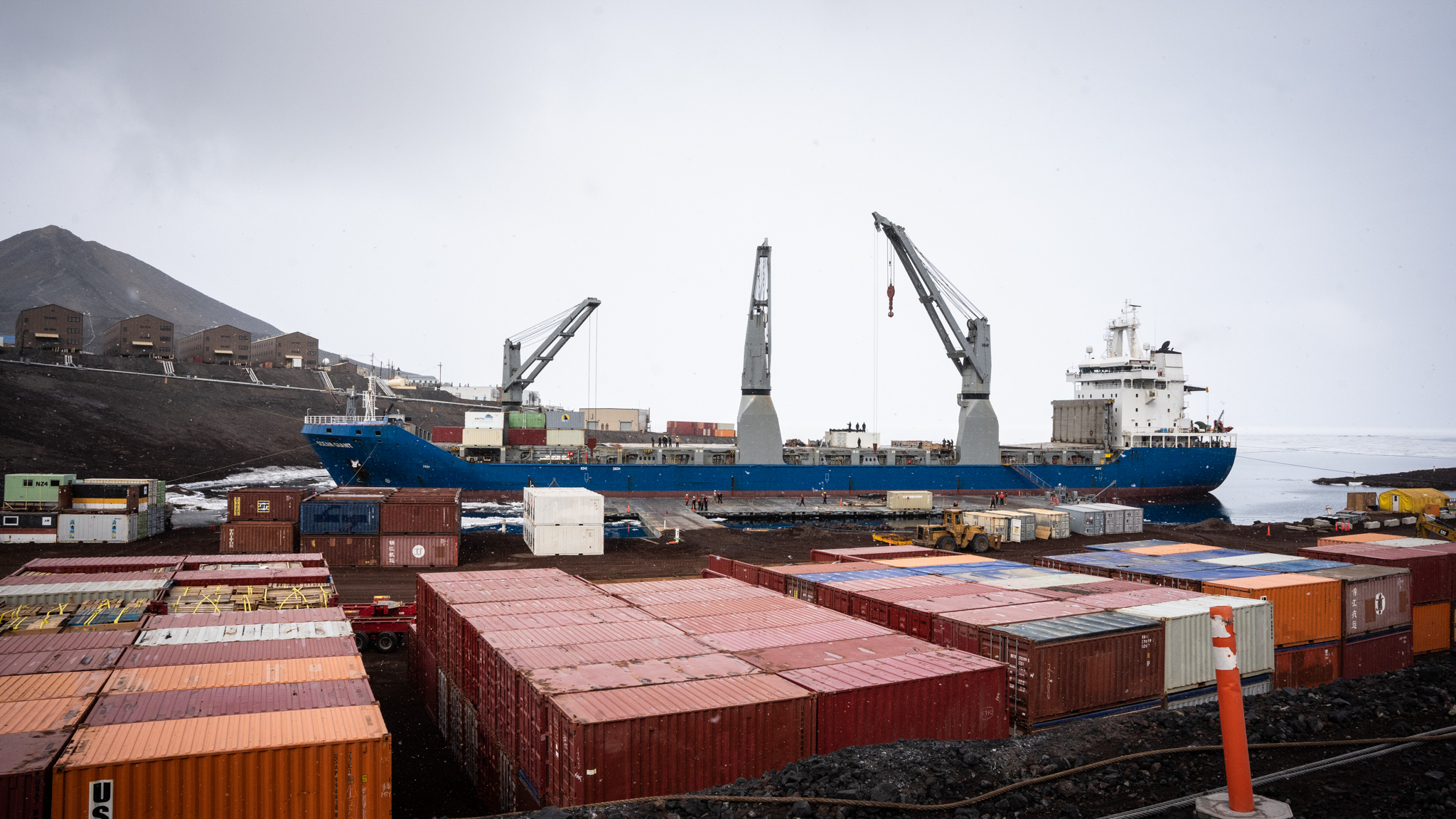 Large cargo ship at dock in harbor