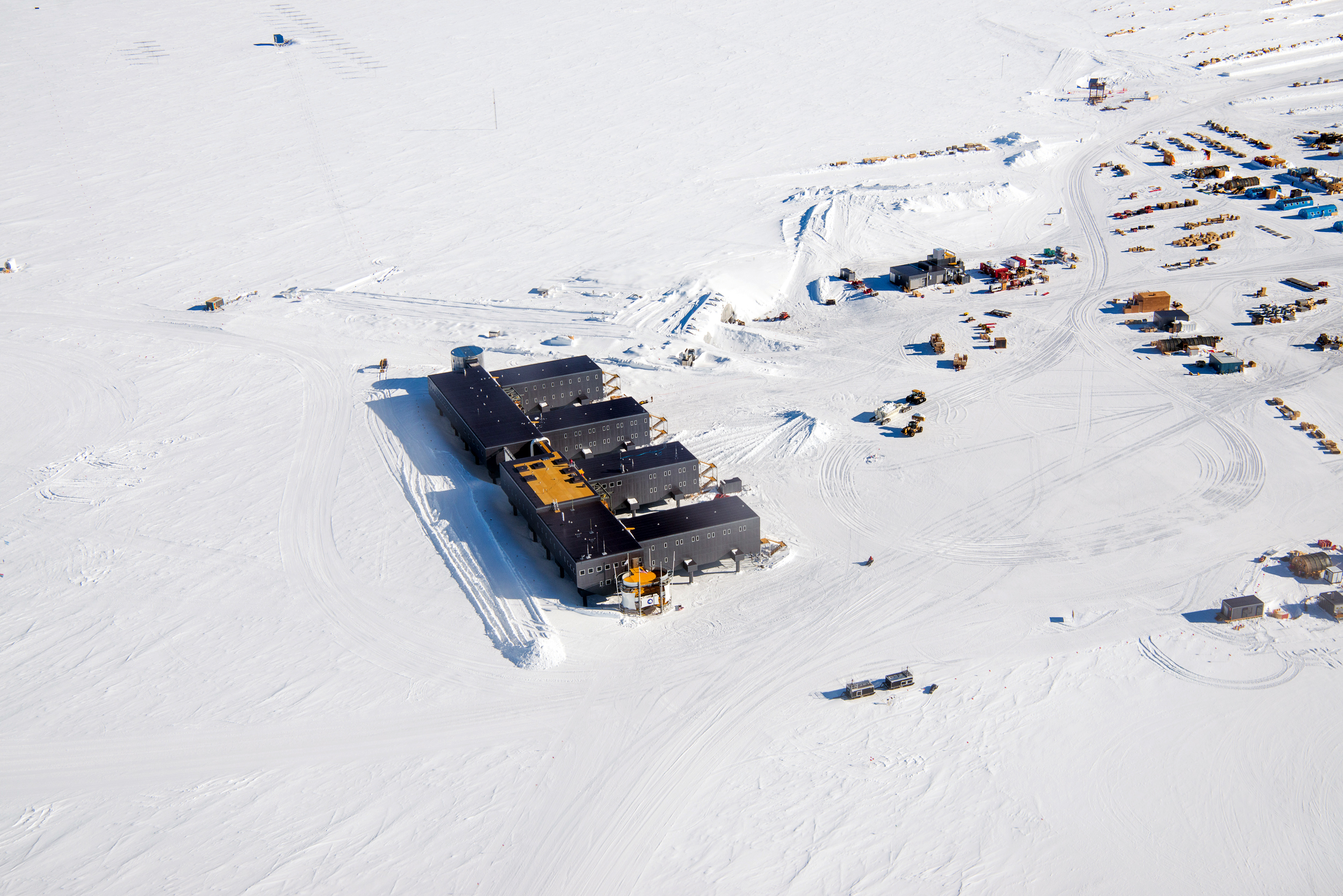 Aerial view of buildings on snow.