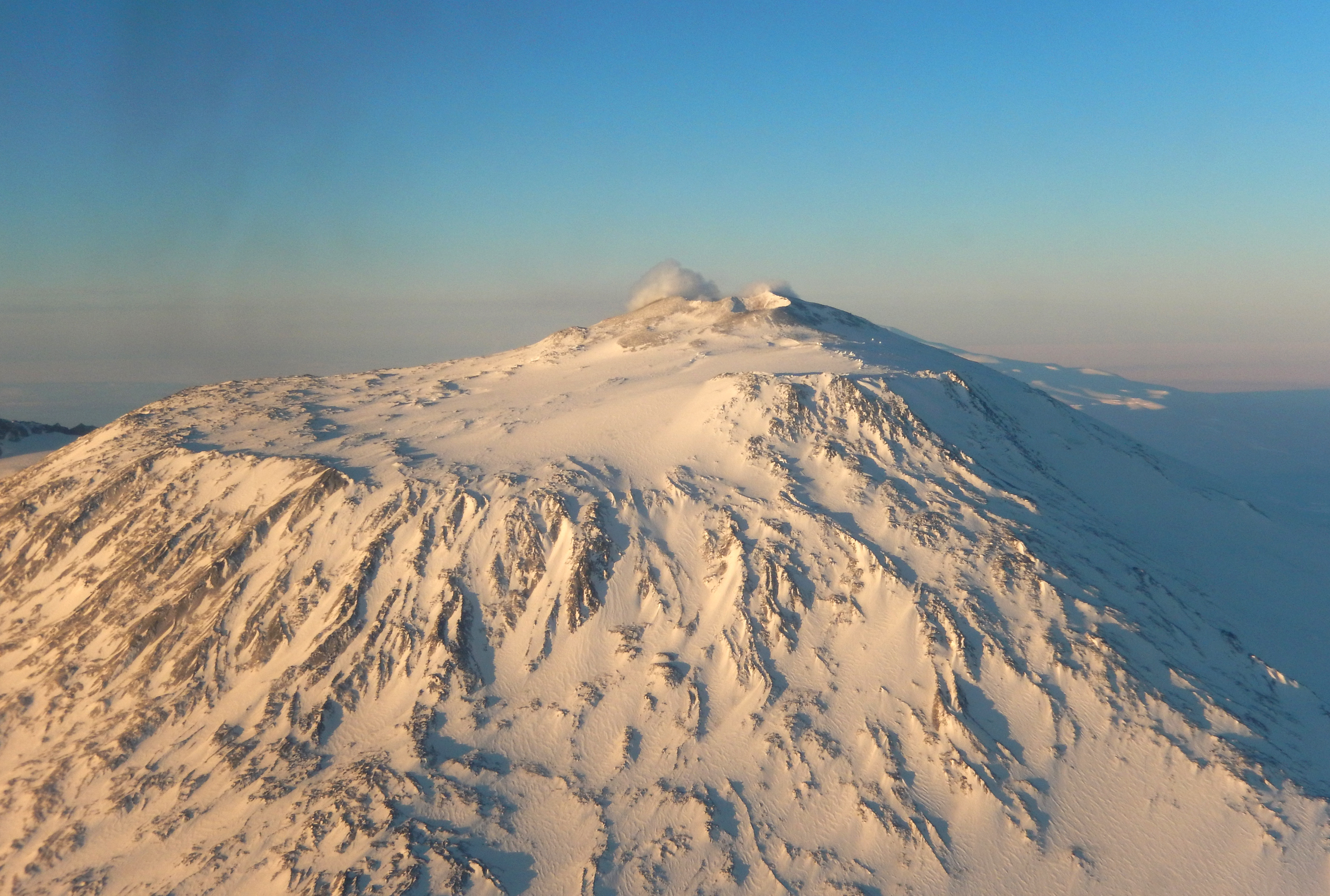 The summit of a snow-covered volcano.