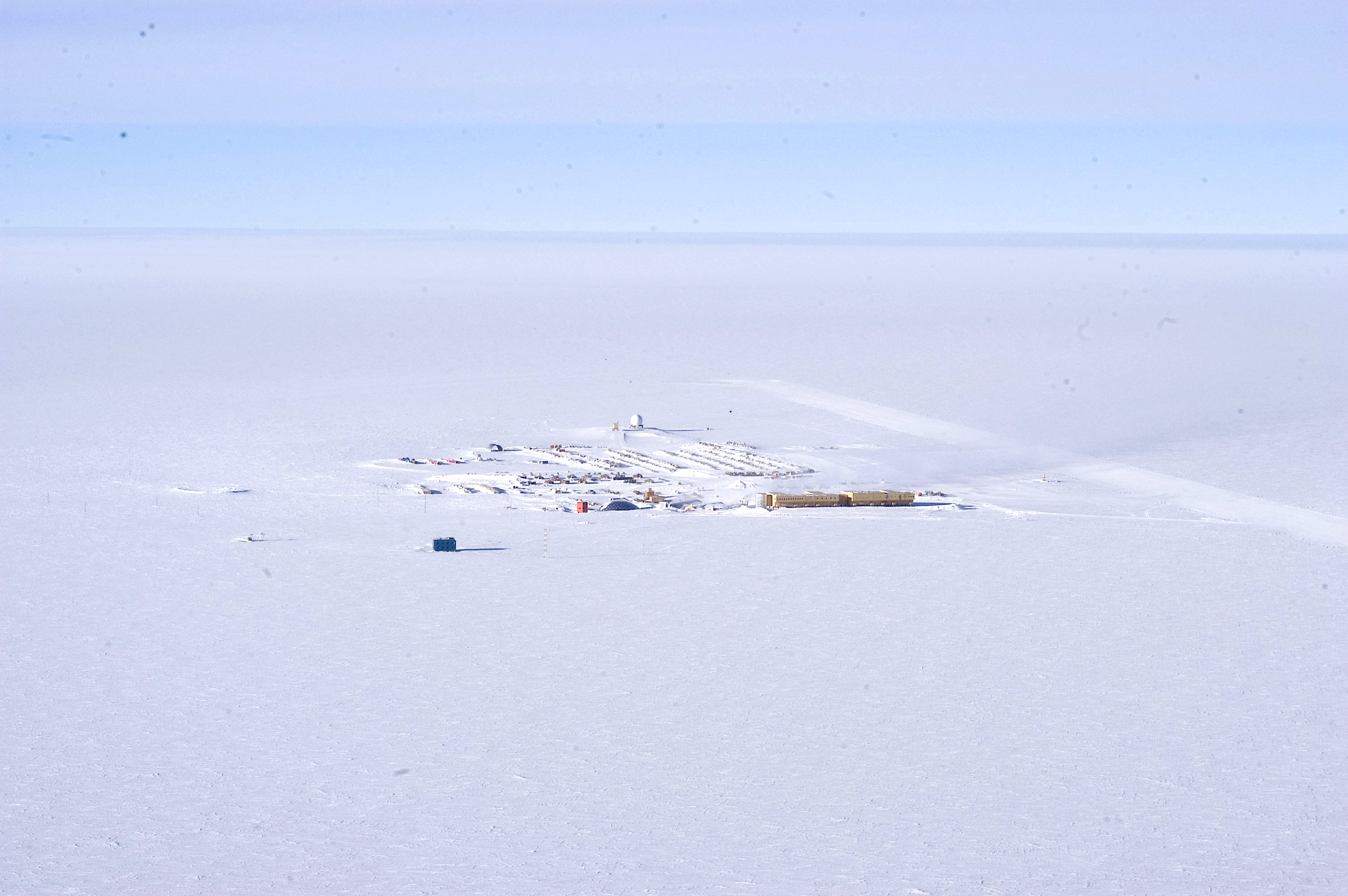 Aerial of buildings on snow.