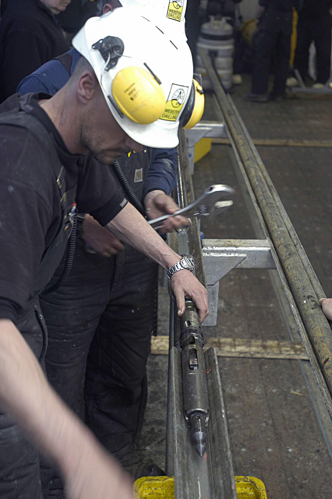 Man removing drill bit.