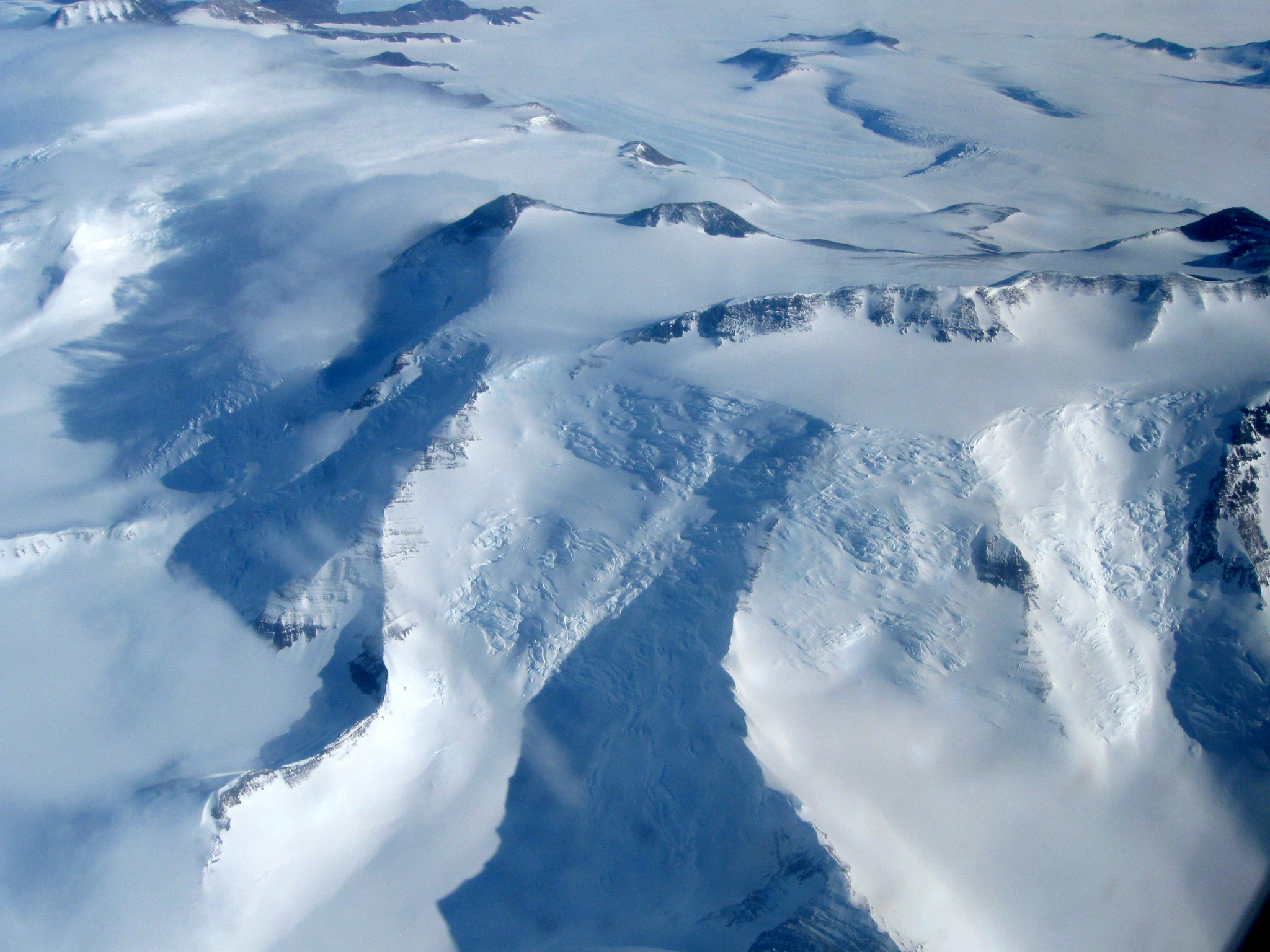 Aerial view of snow covered mountains.