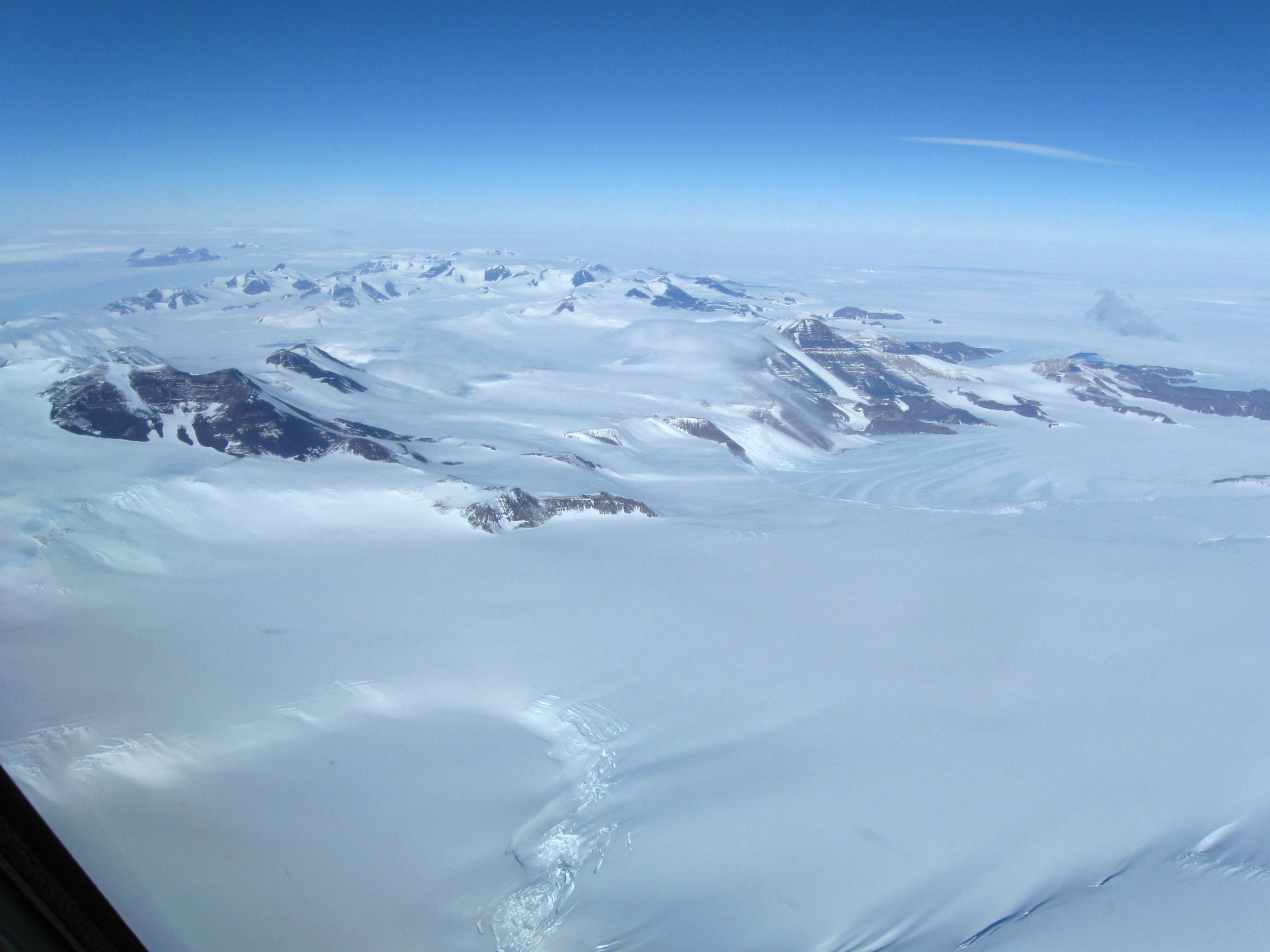 Aerial view of snow covered mountains.