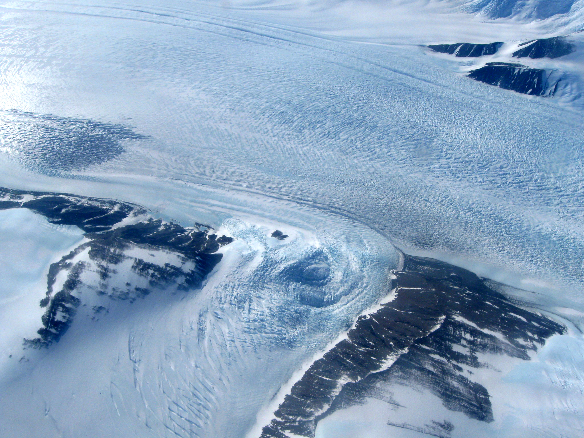 Aerial view of snow covered mountains.