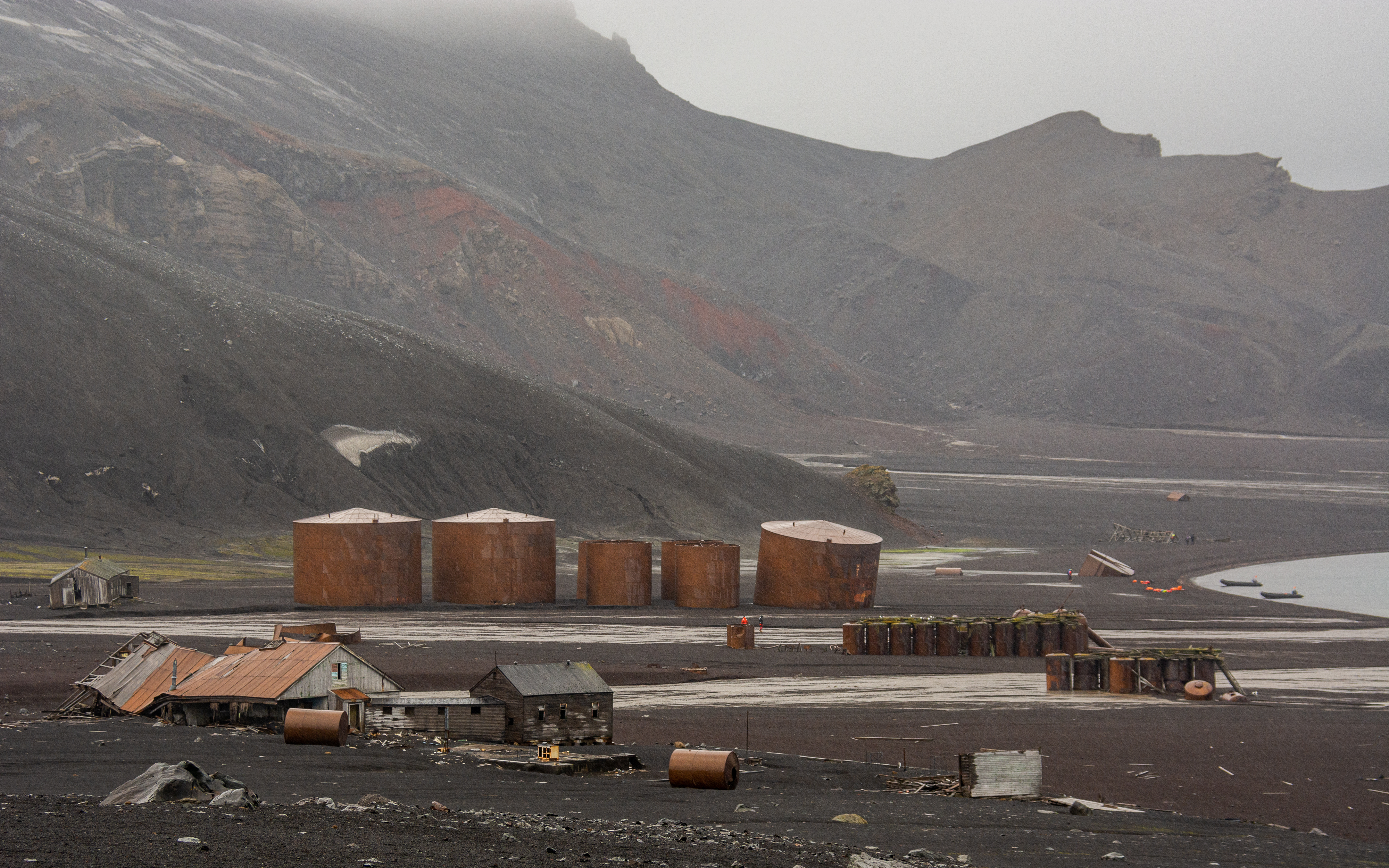 Rusting water tanks, collapsing buildings and rusting structures.