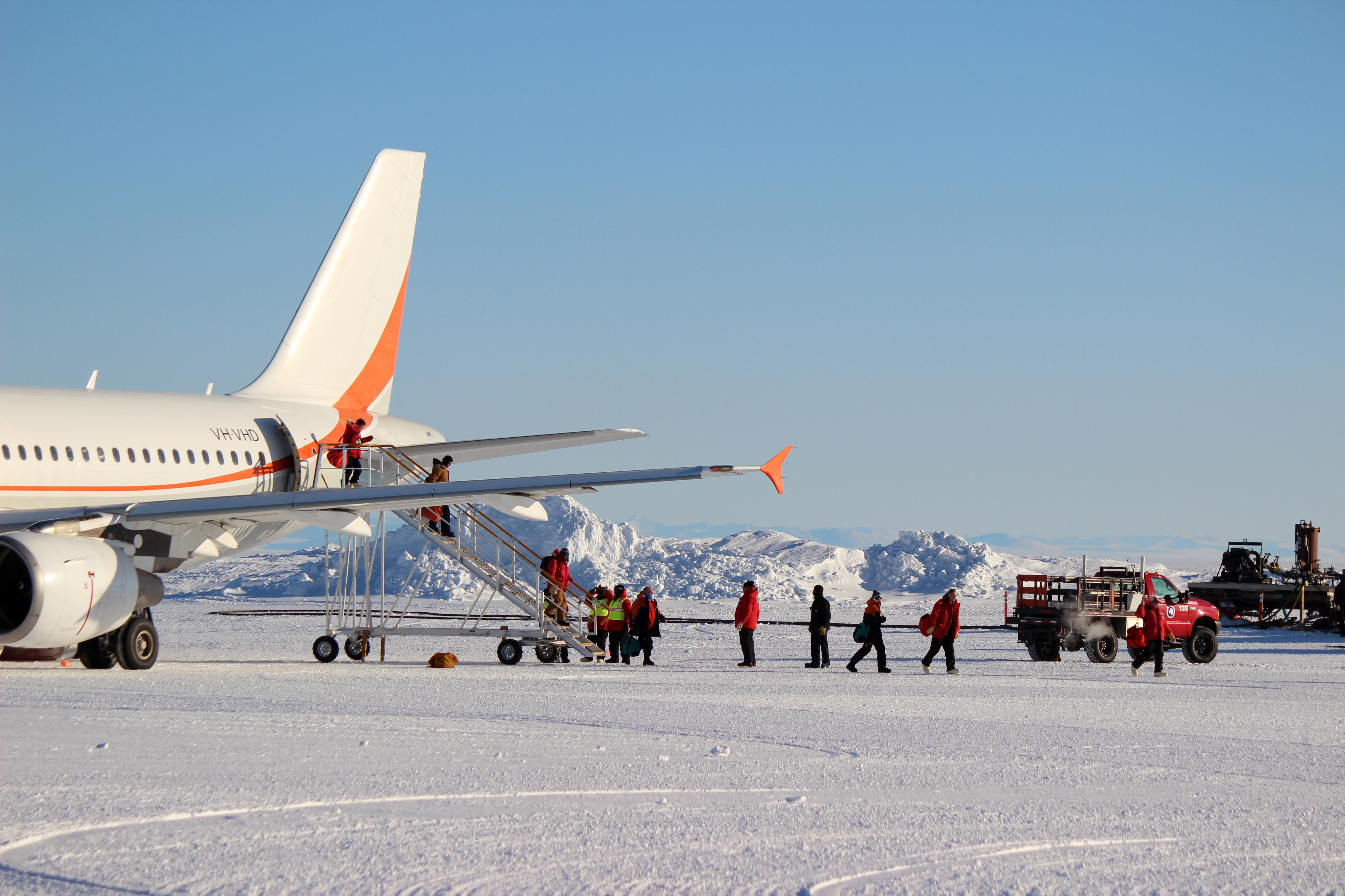 People disembarking an airplane.