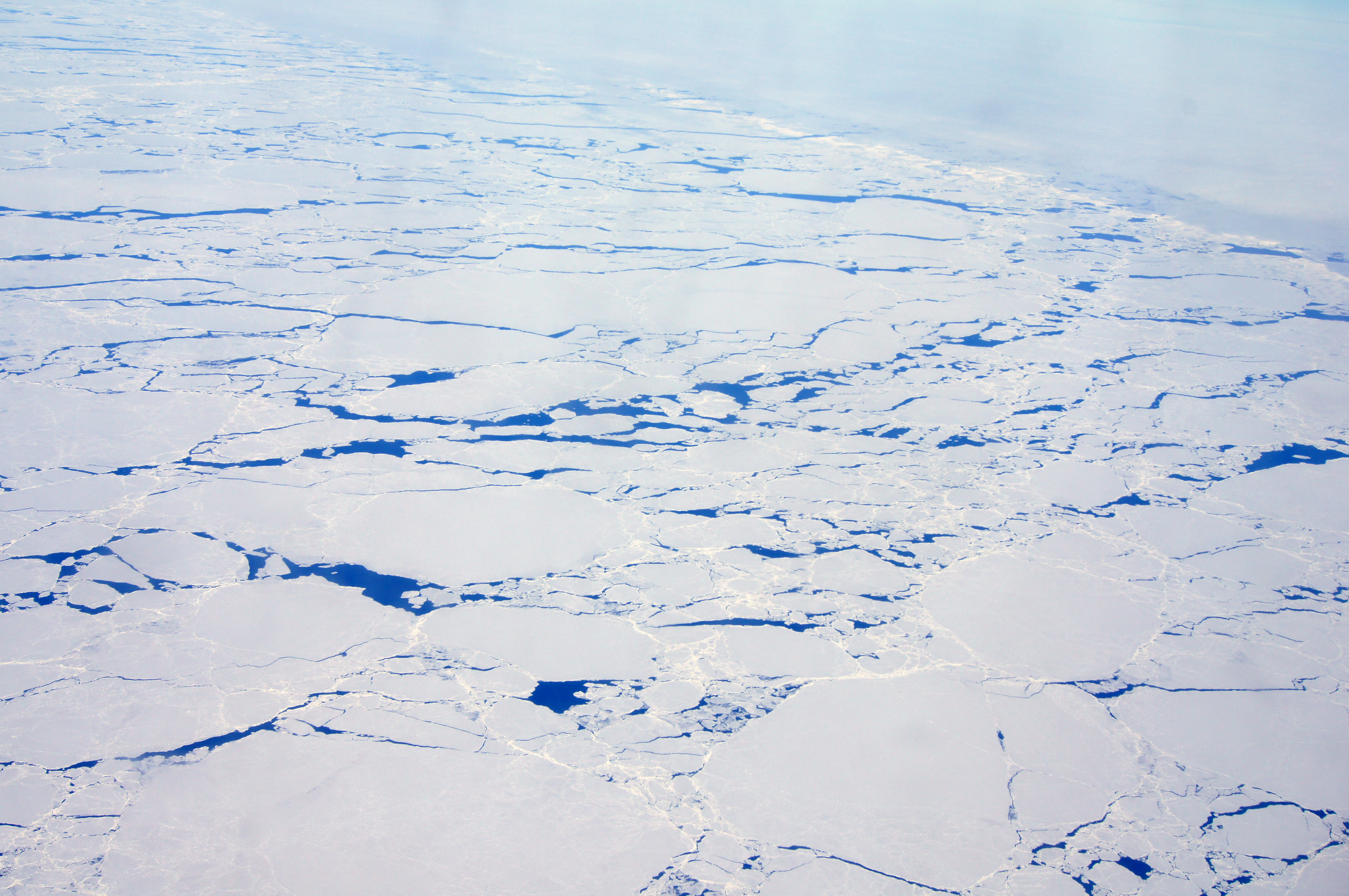 Aerial view of ice-covered water.