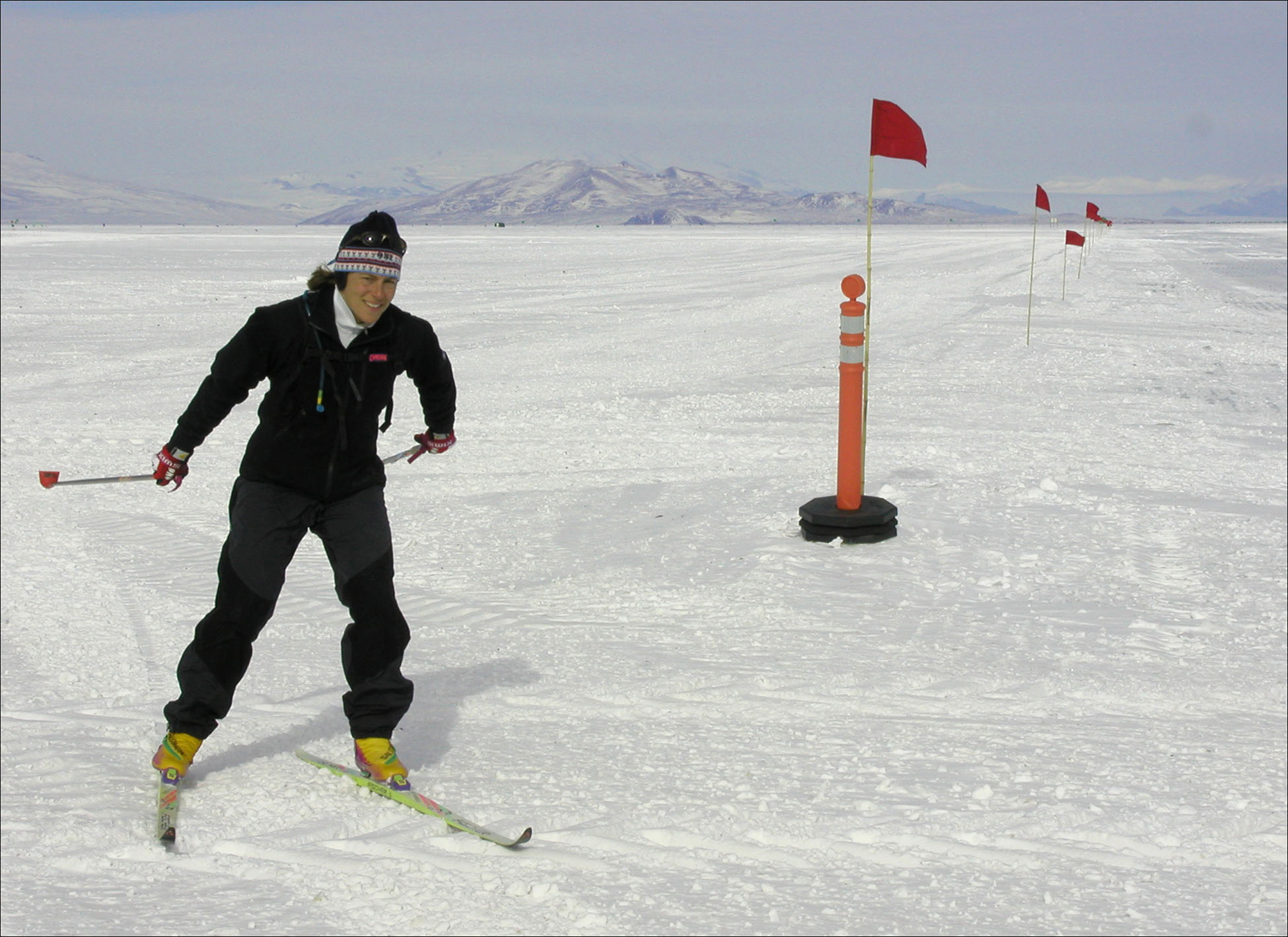 A woman cross-country skis.