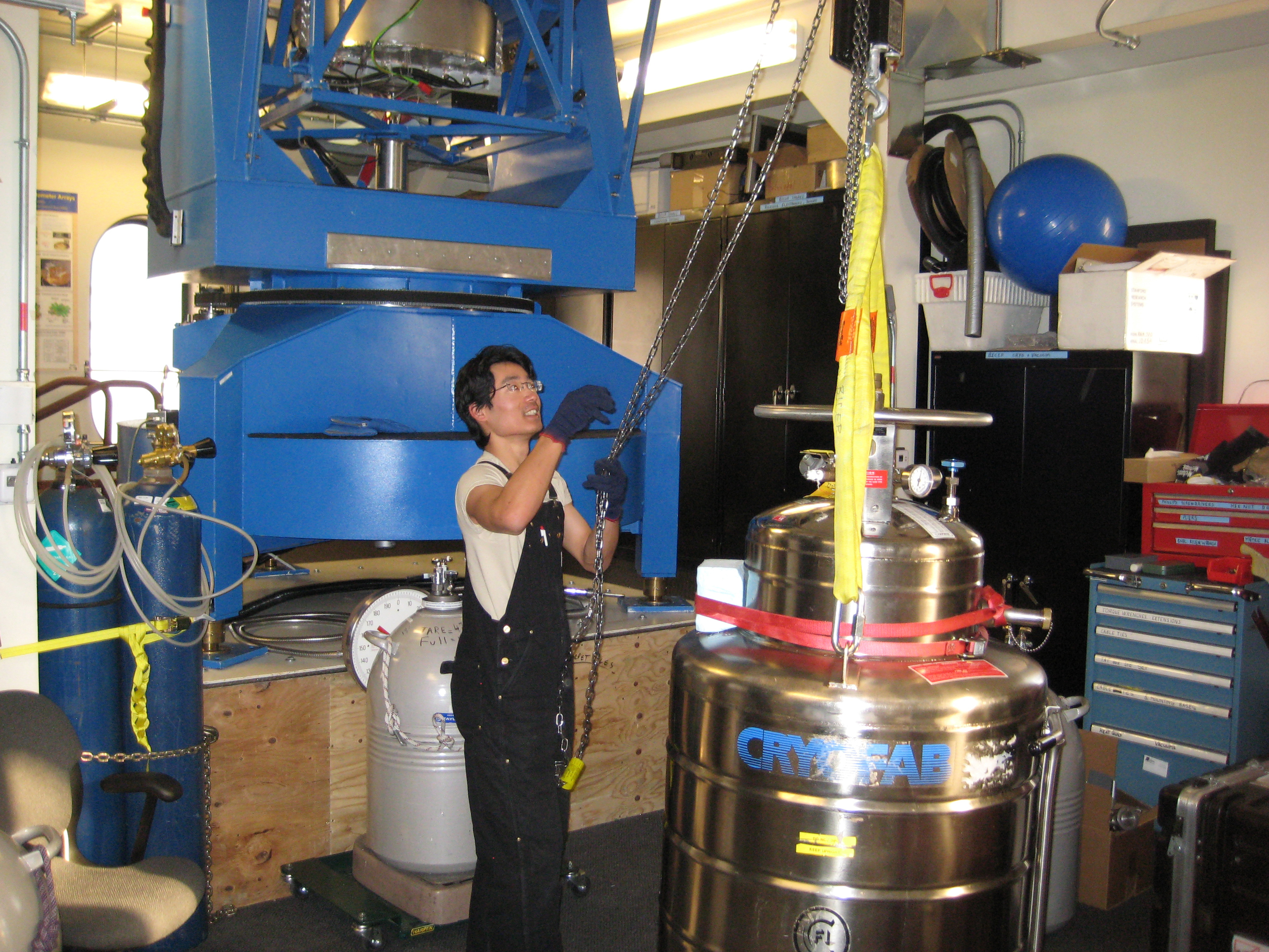 Man working with large scientific instruments.