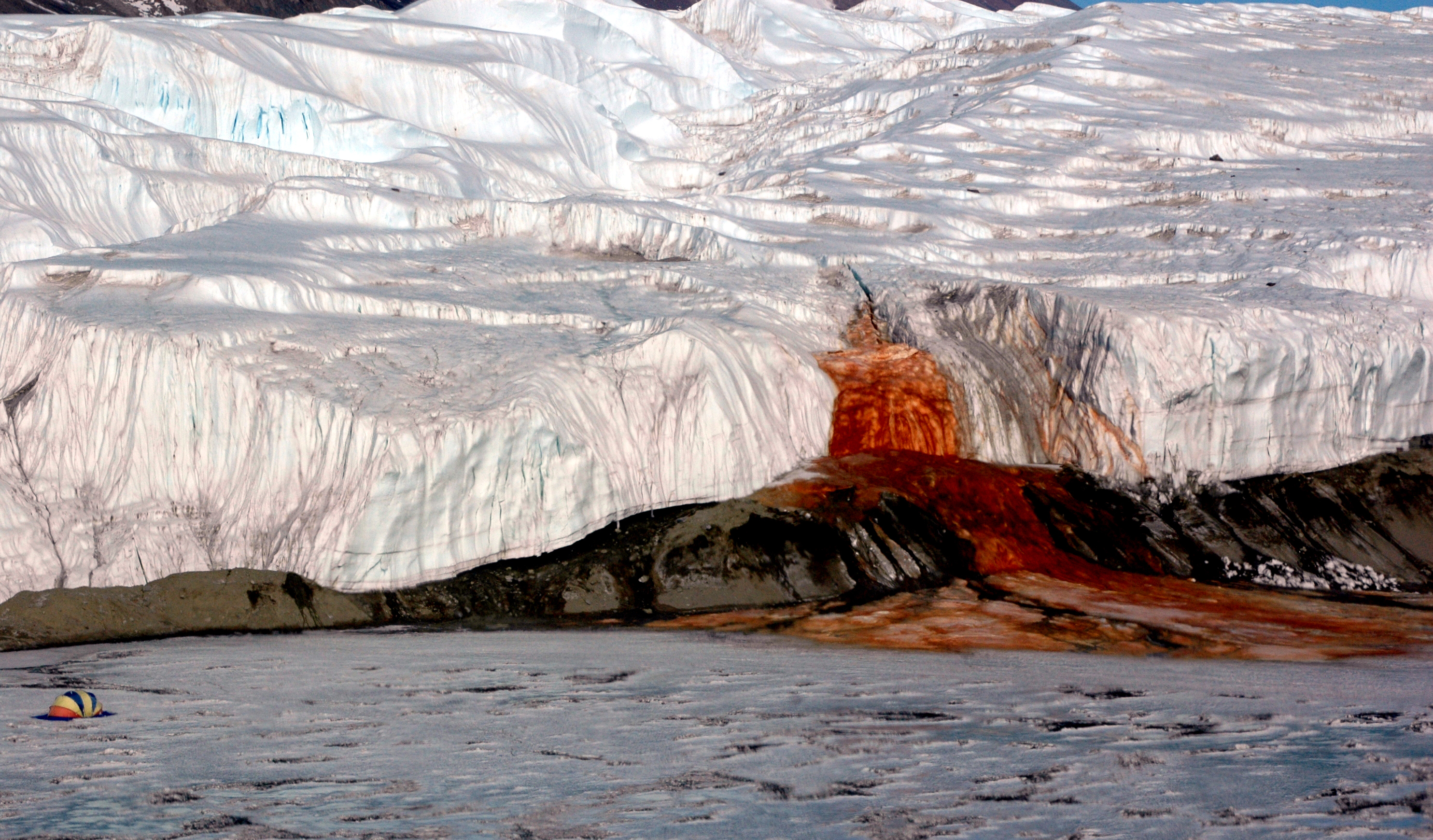 Red substance seeping from glacier.