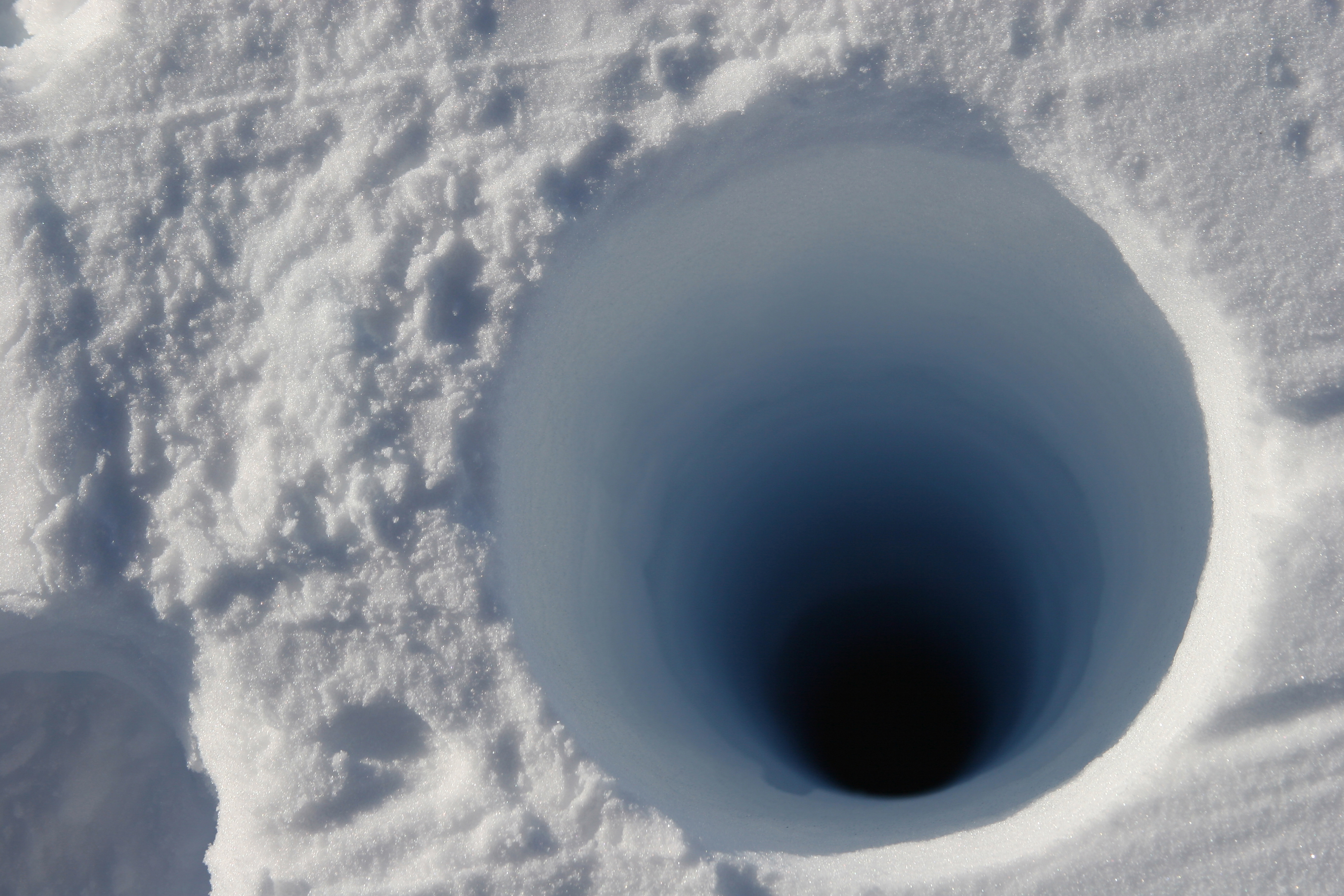 Hole in snow.