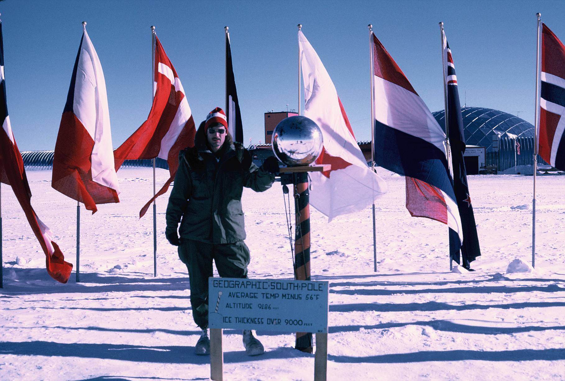 A man surrounded by flags.