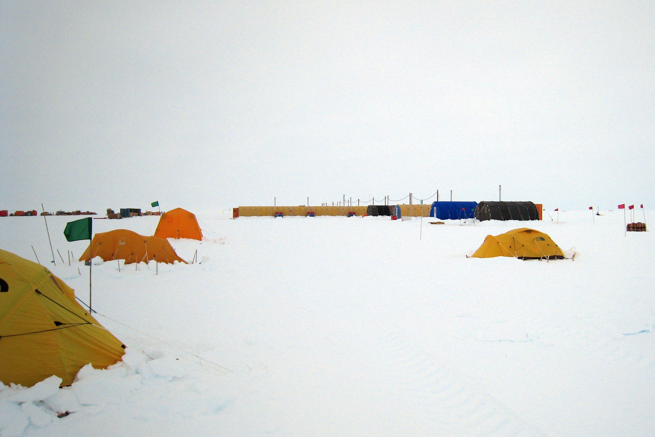 Tents and buildings on snow.