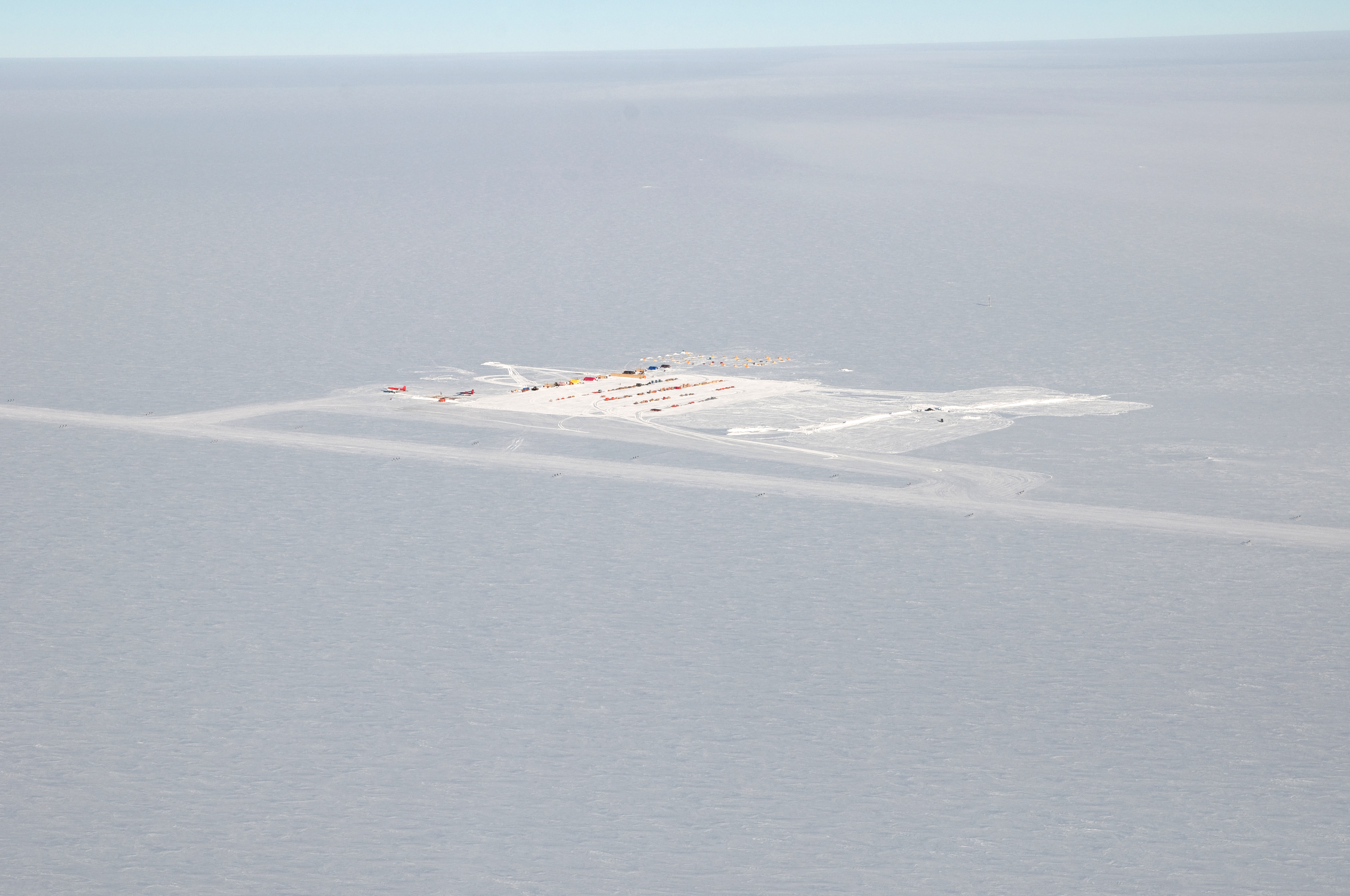 Aerial photo of buildings on snow.