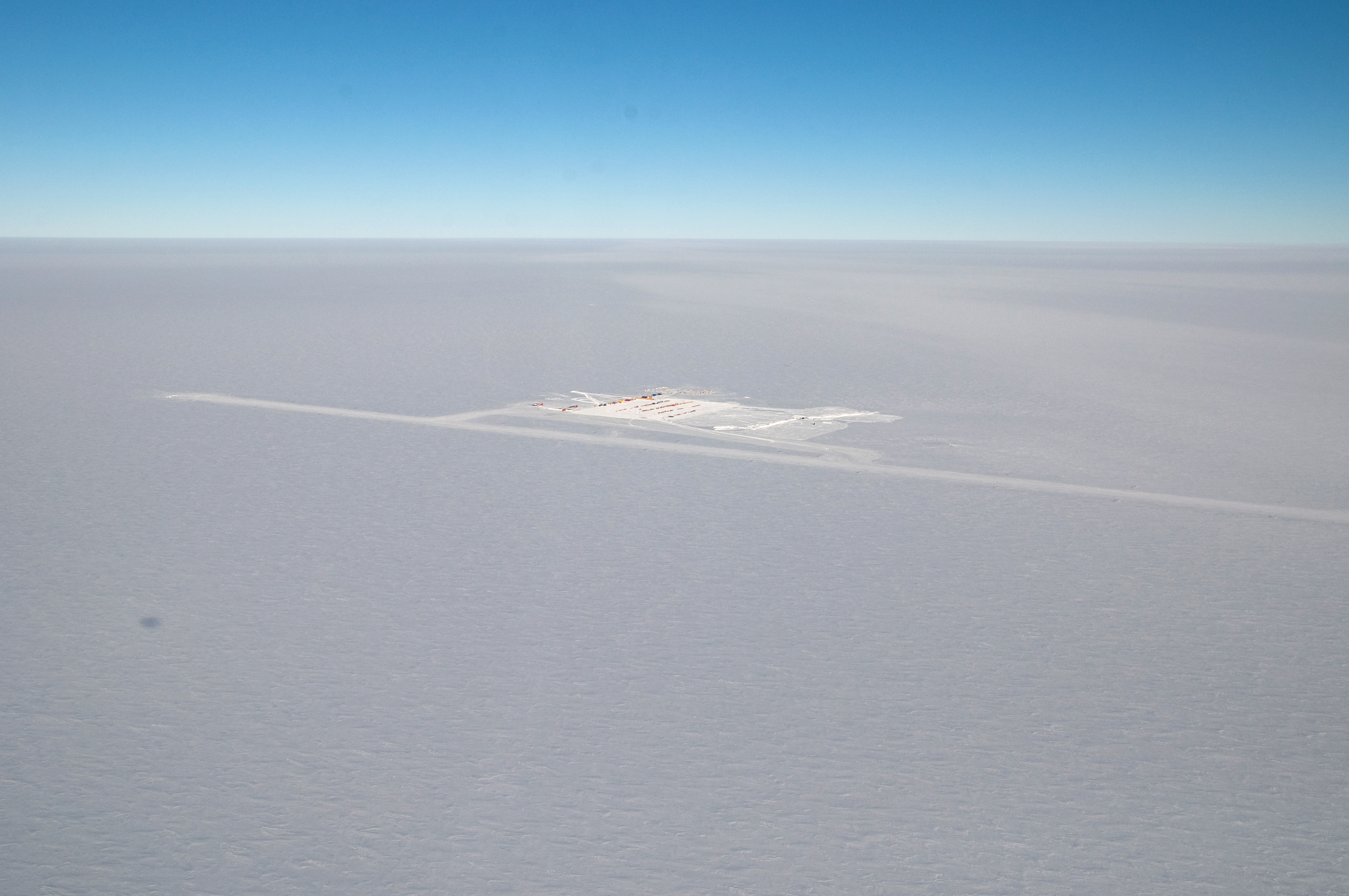 Aerial photo of buildings on snow.