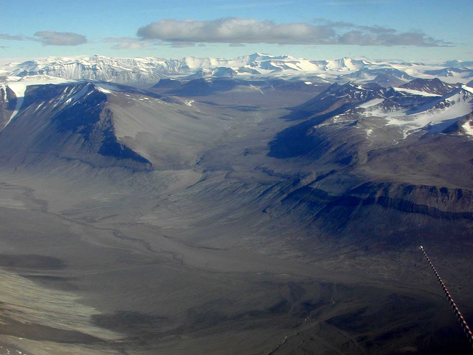 An aerial view of very dry mountain valleys.