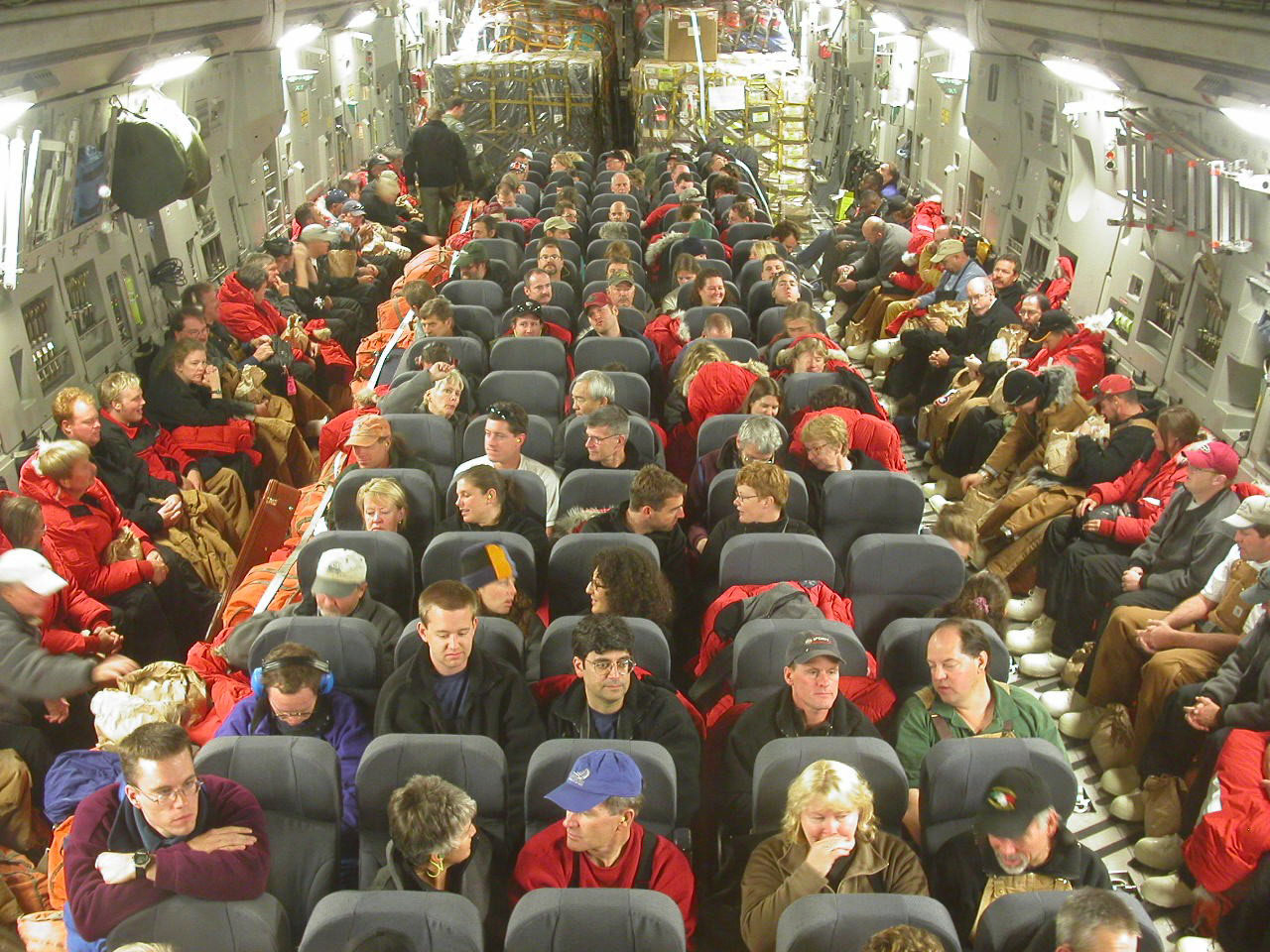 People sit in a large airplane.