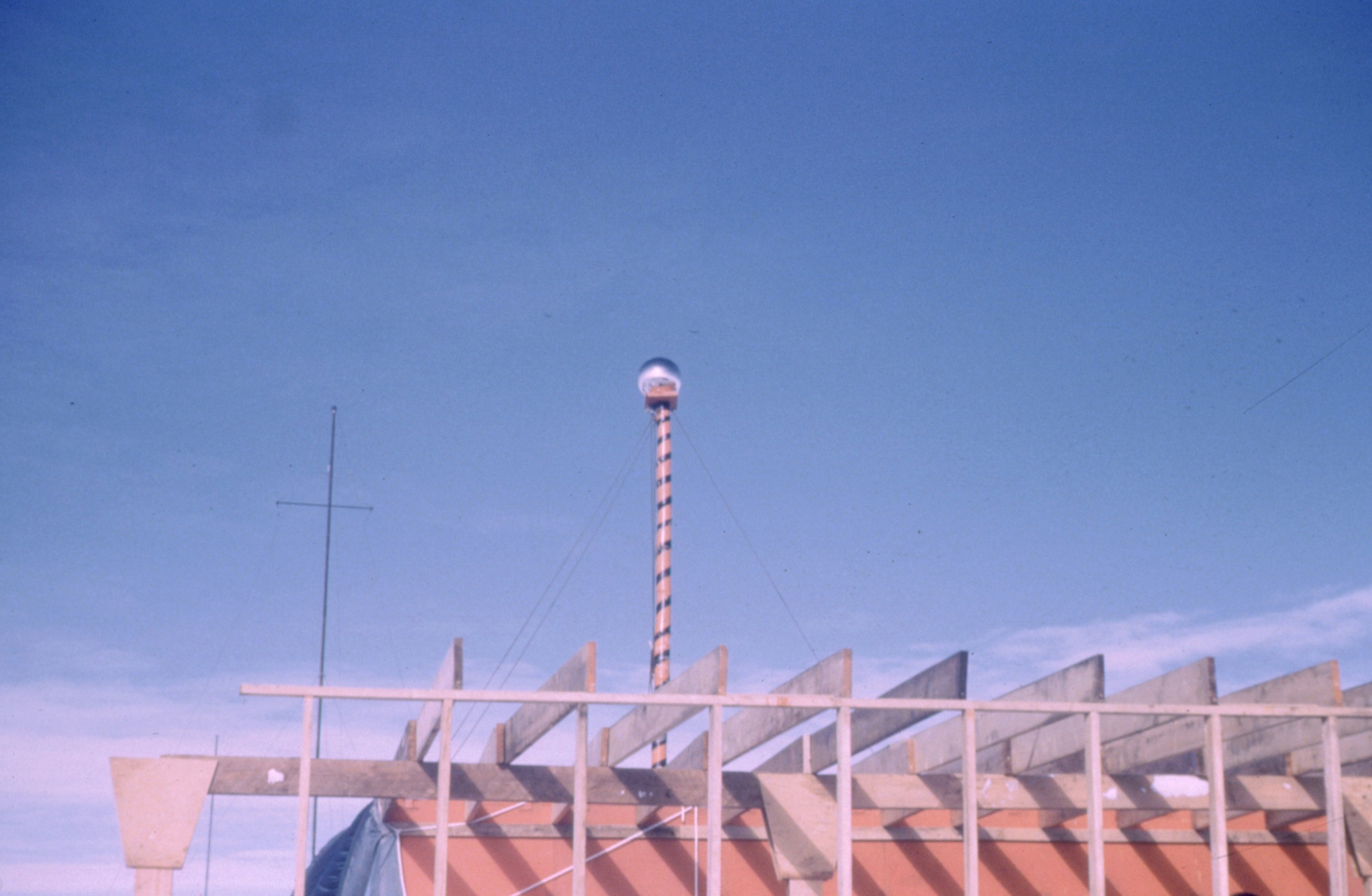 A pole on a roof.