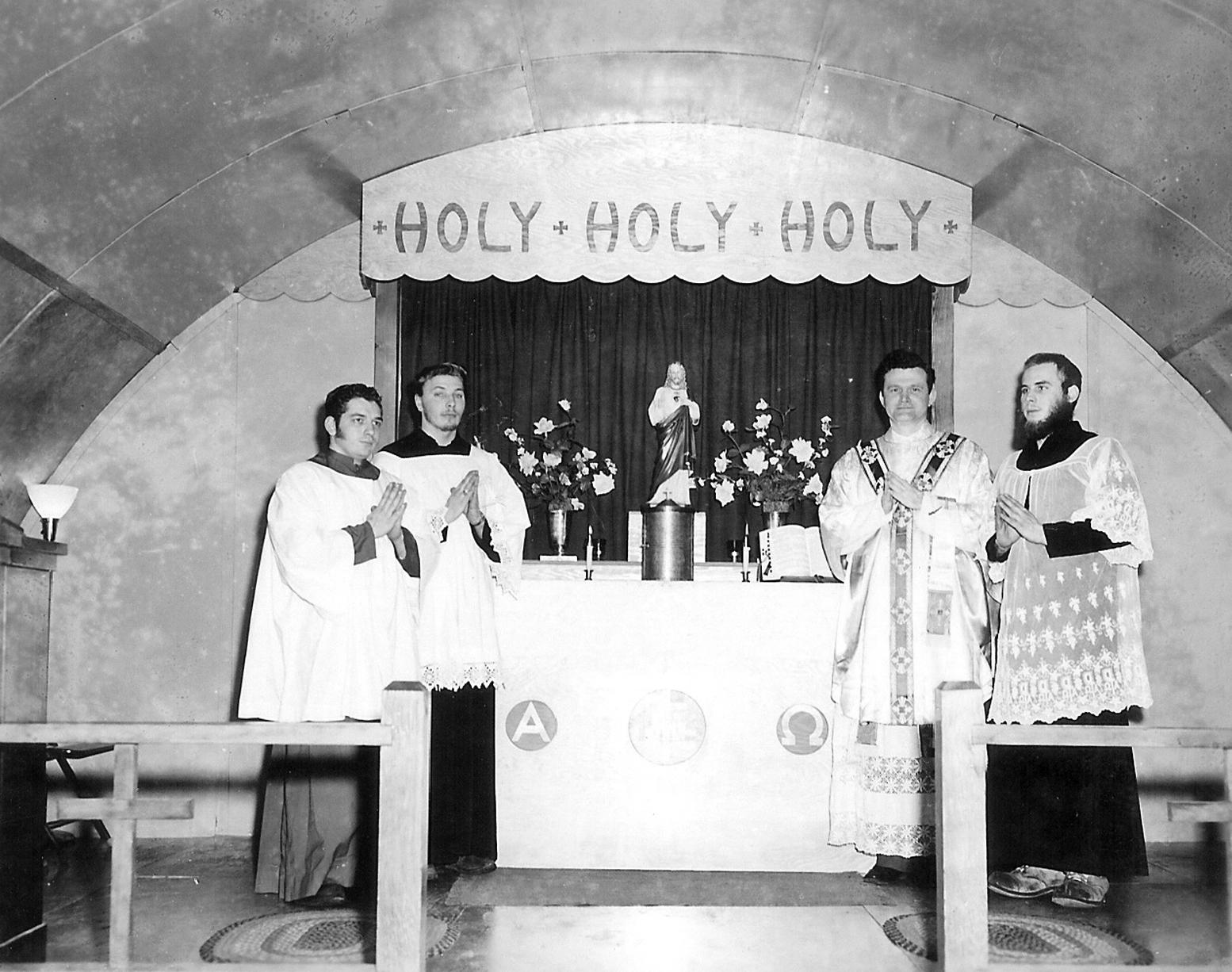 Men stand around an altar in a church.