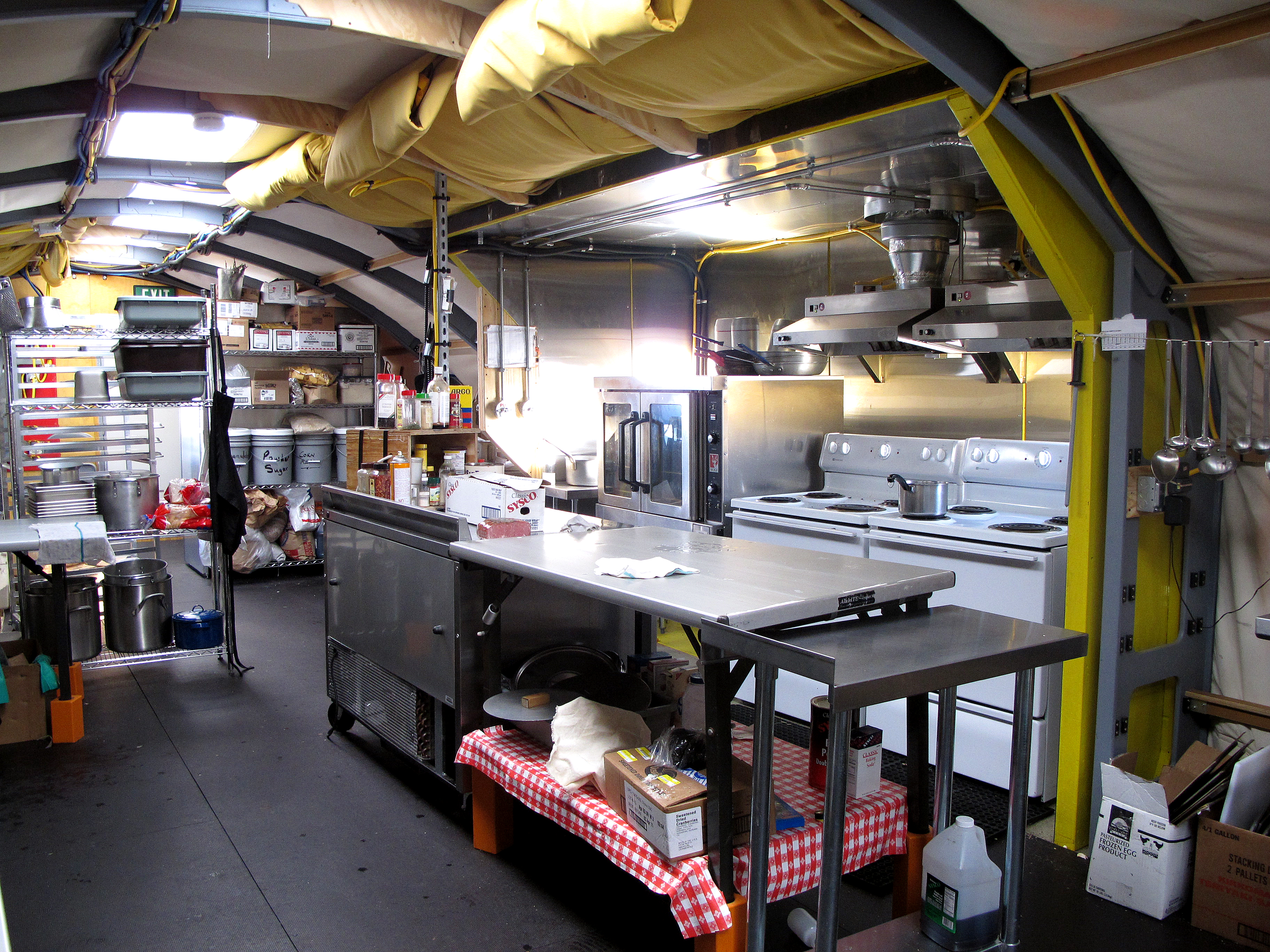 A kitchen inside a tent.