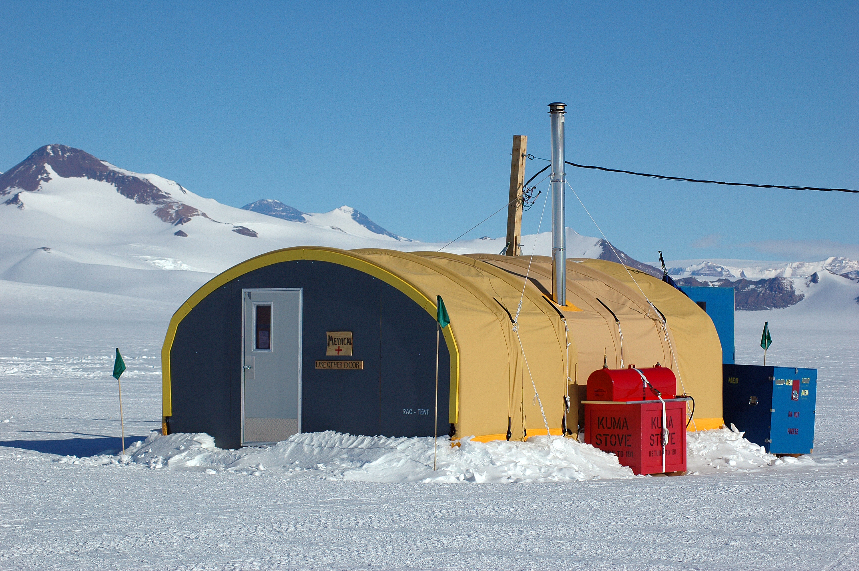 A tent sits in snow.