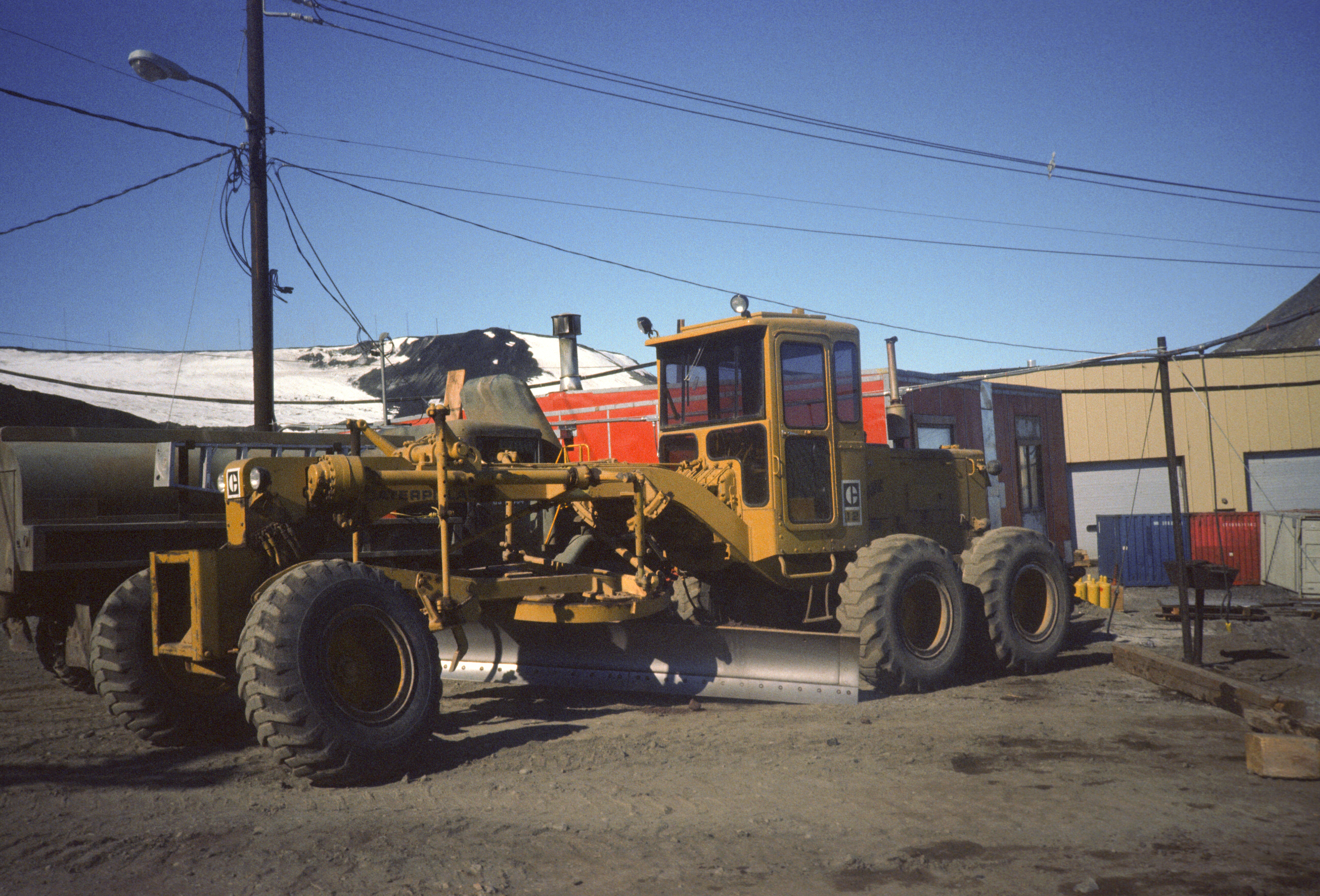 A Caterpillar road grader.