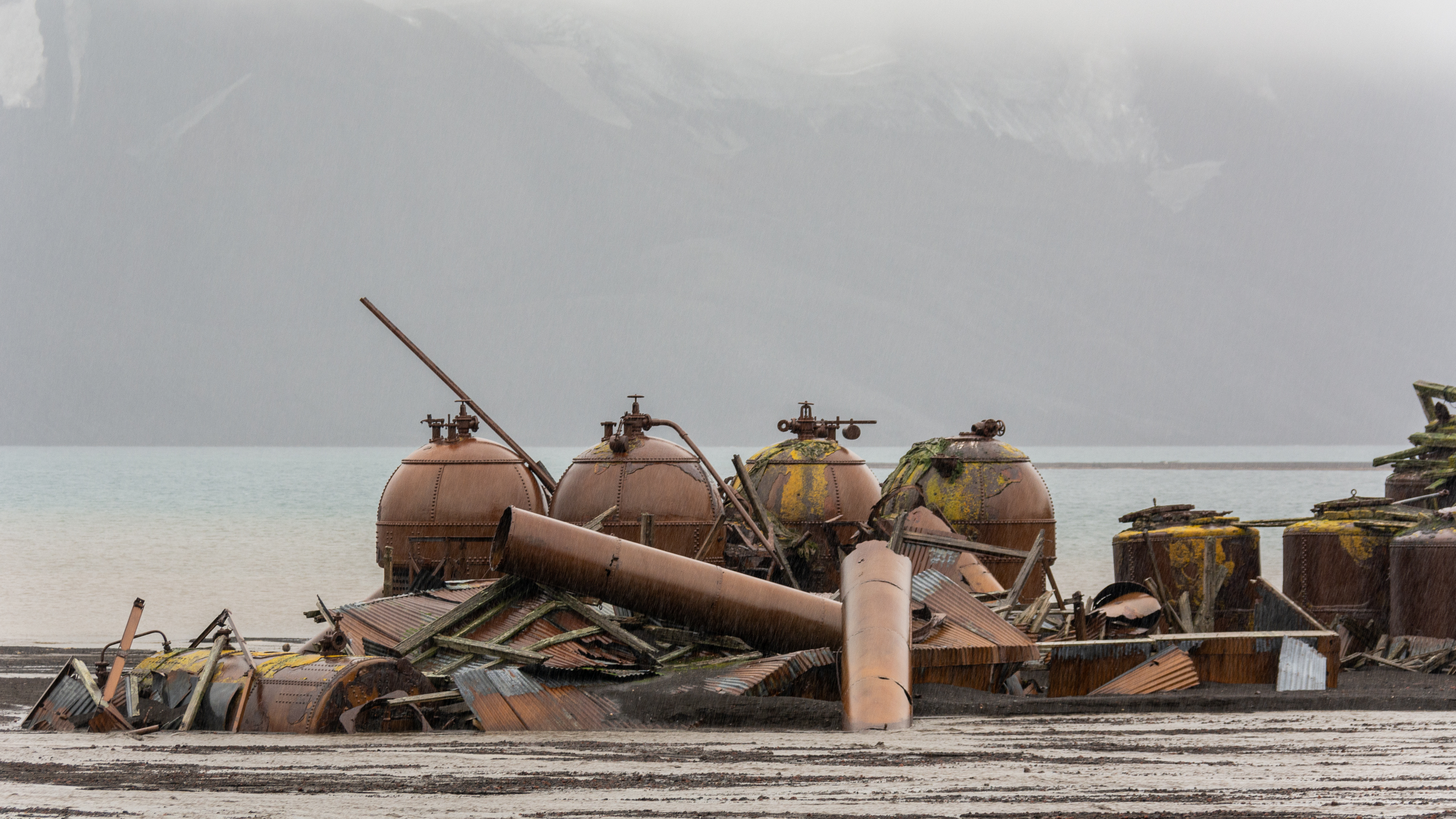 Rusting structures near shore.