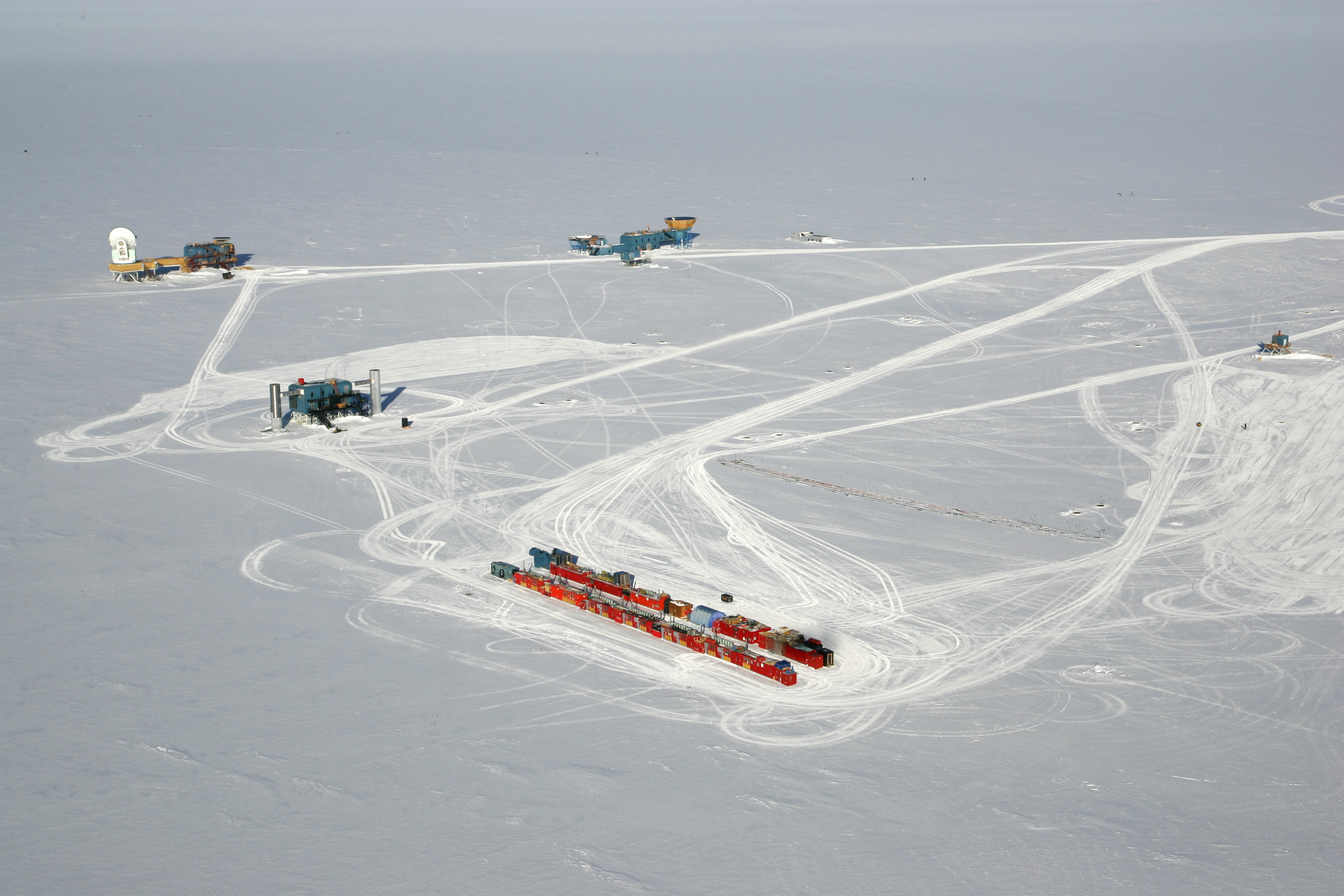 Aerial photo of buildings on snow.