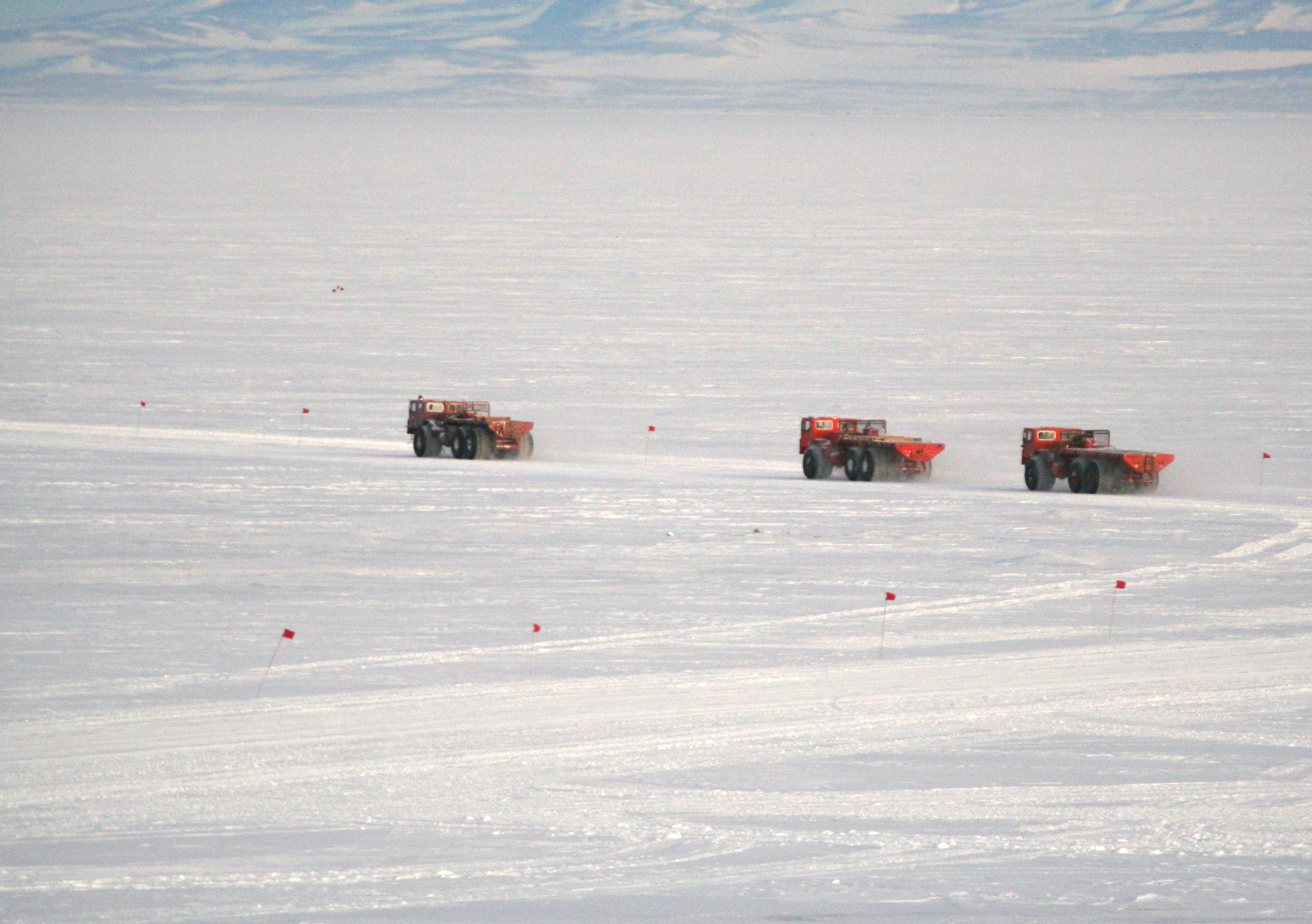 Three trucks on ice.