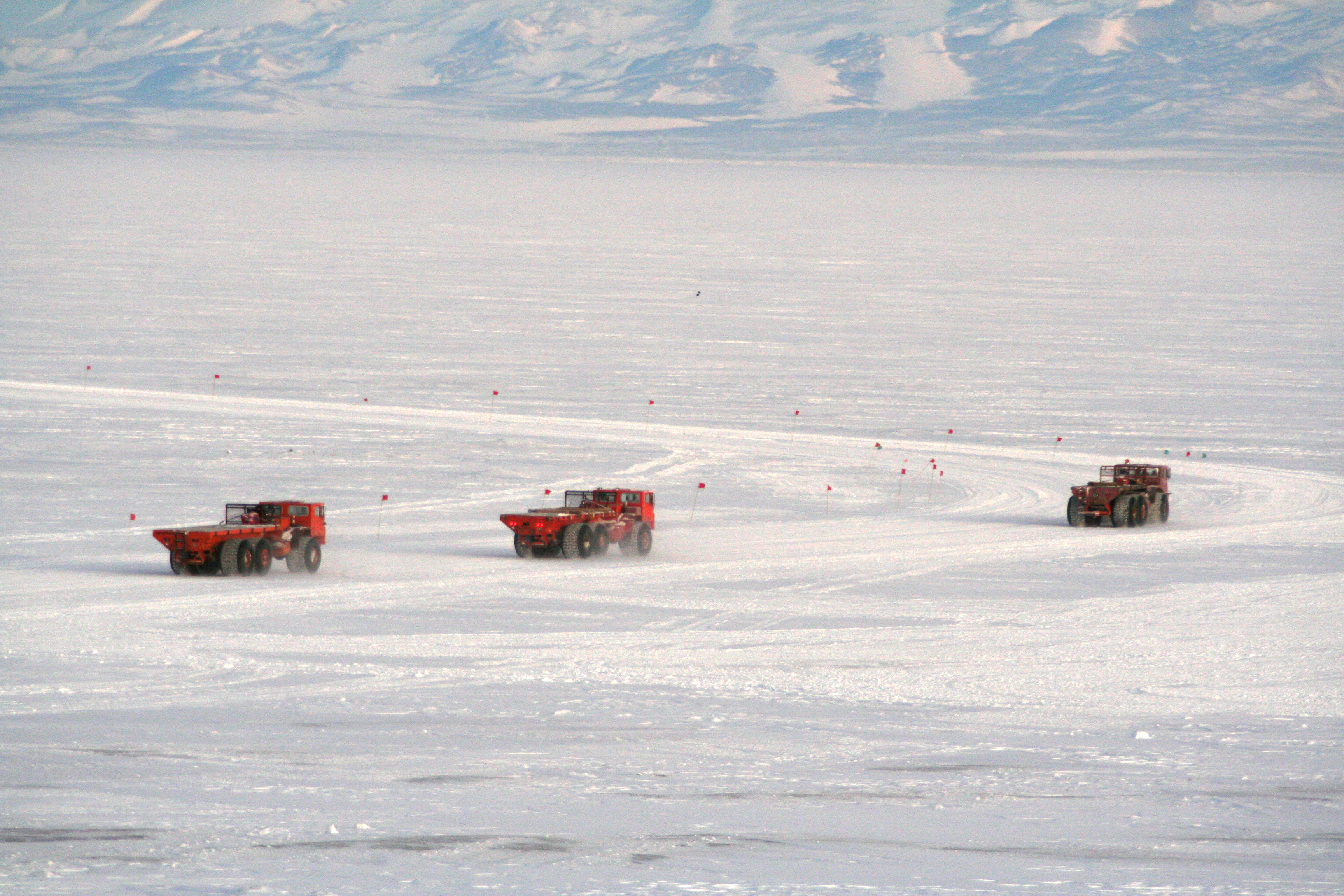 Three trucks on ice.