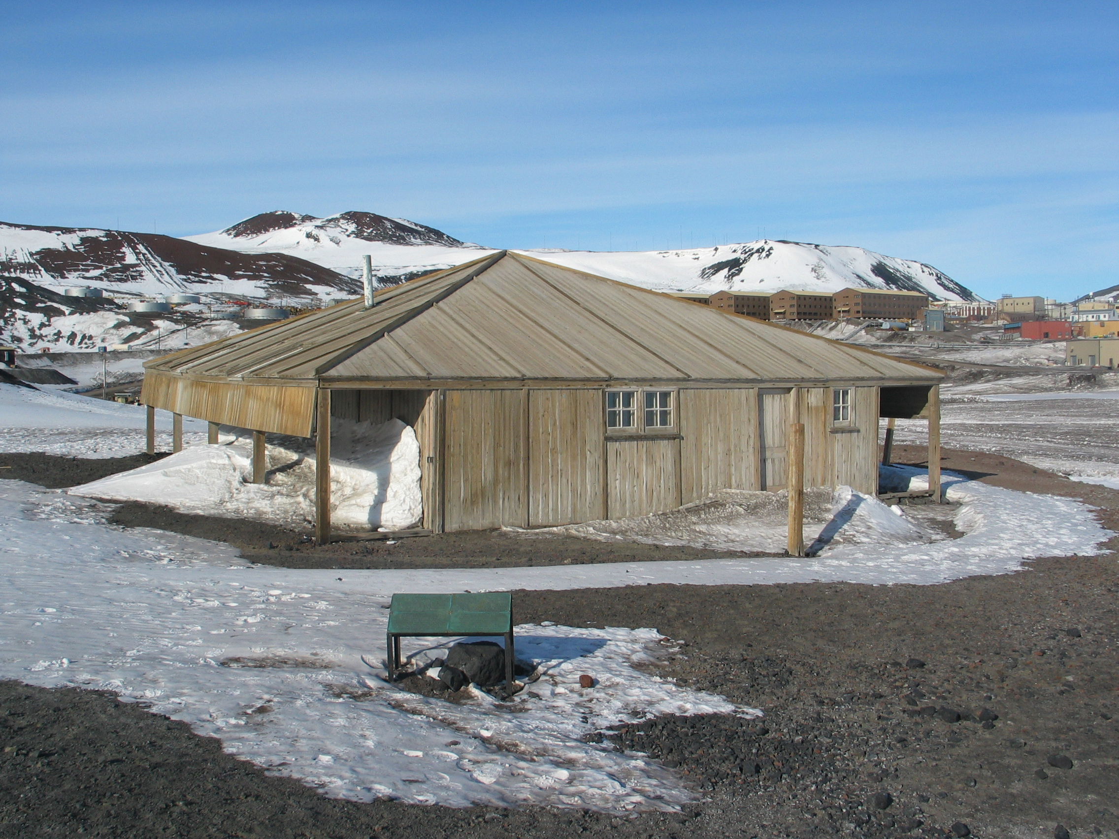 Wooden hut in foreground.