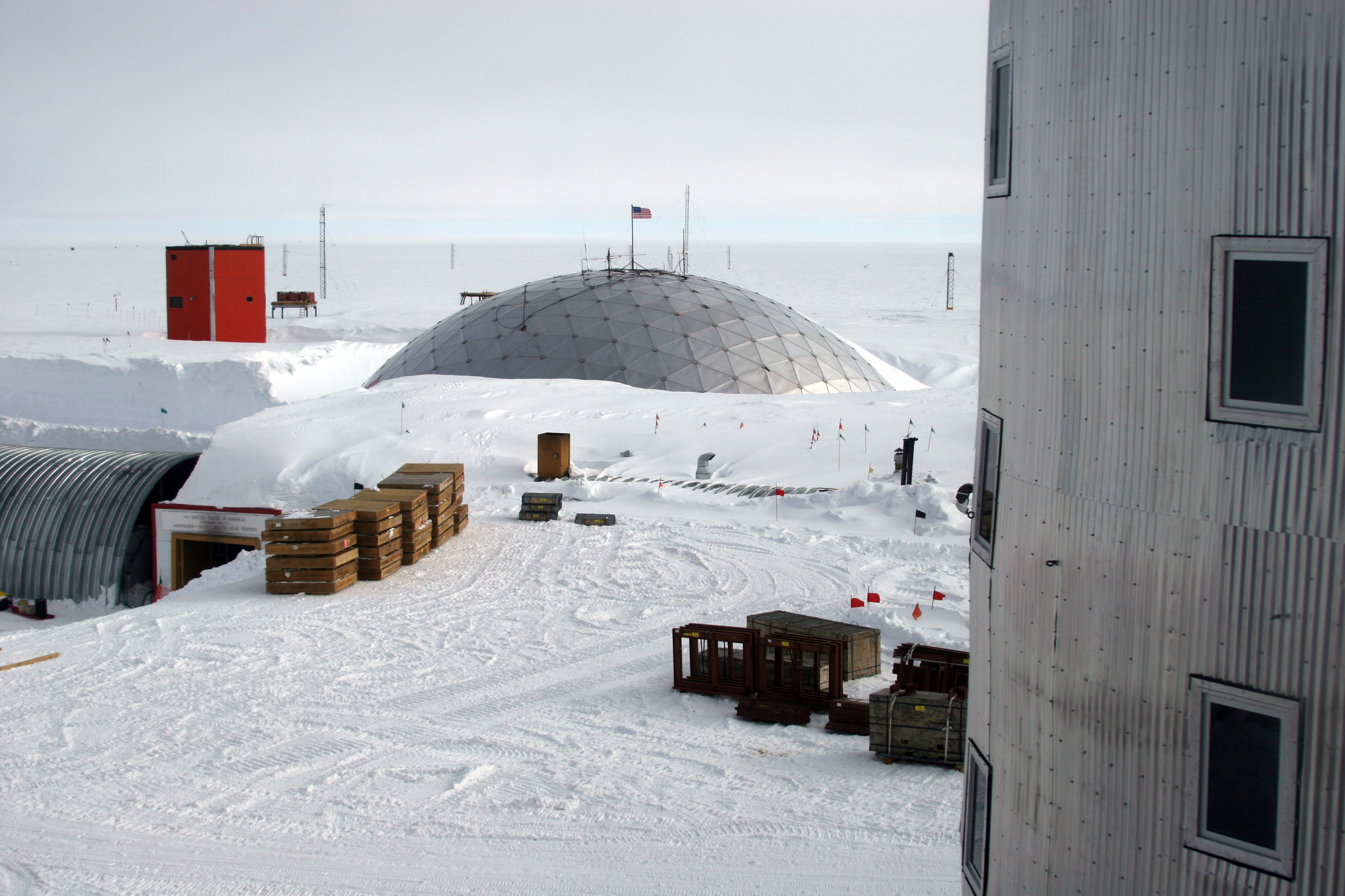 A metal dome sits in the snow.