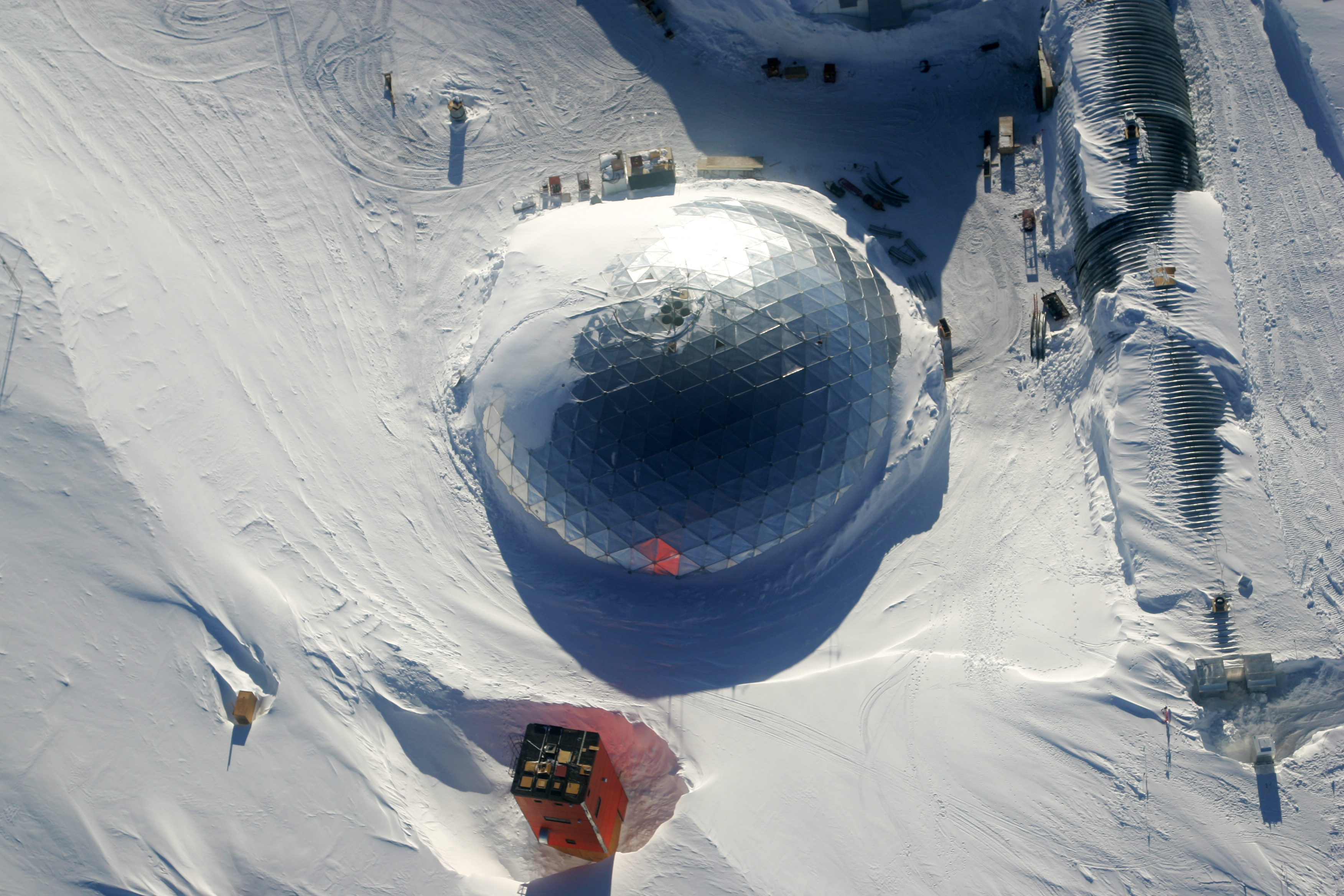 Aerial photo of buildings on snow.