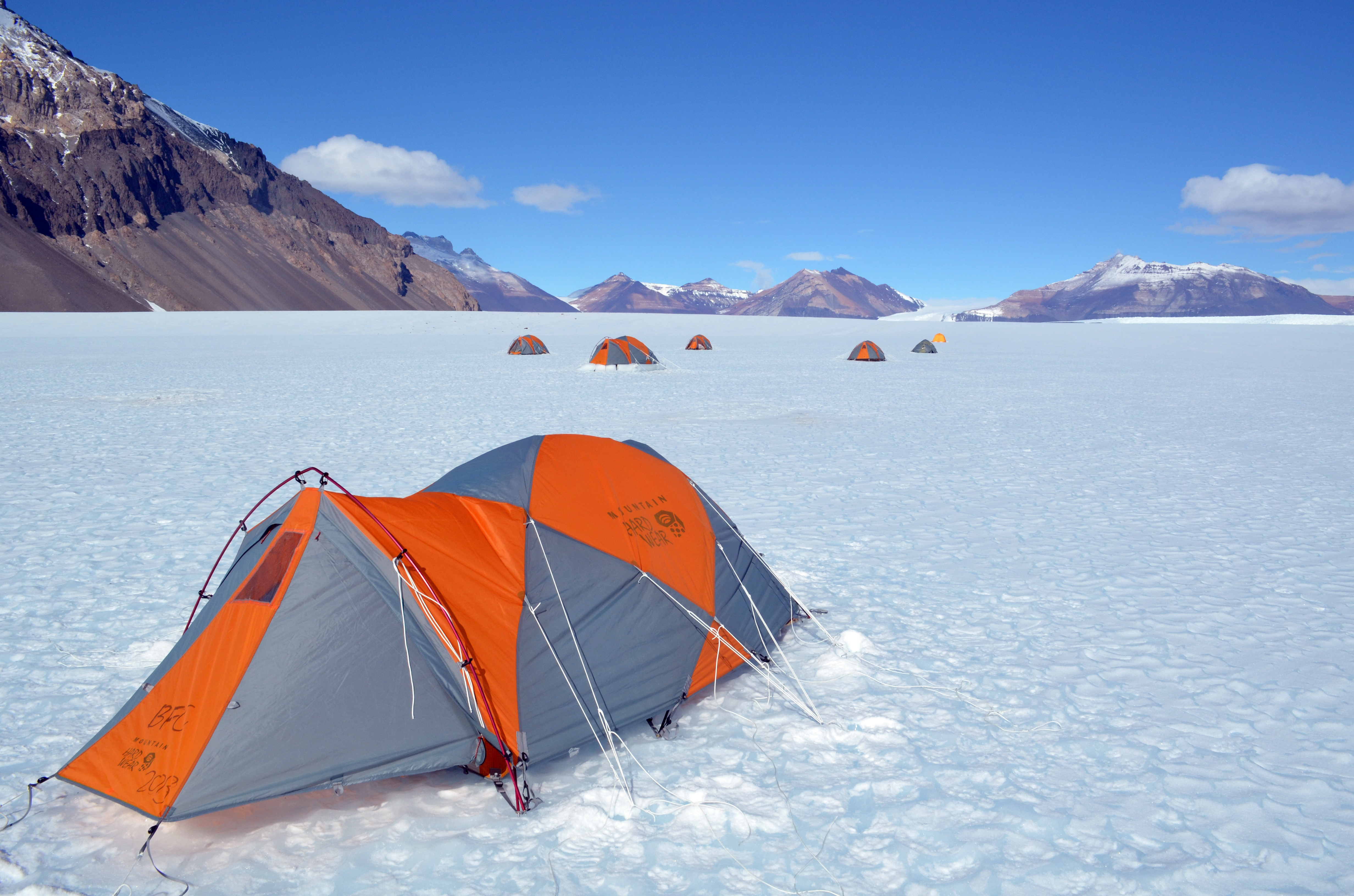 A tent is set up on ice.