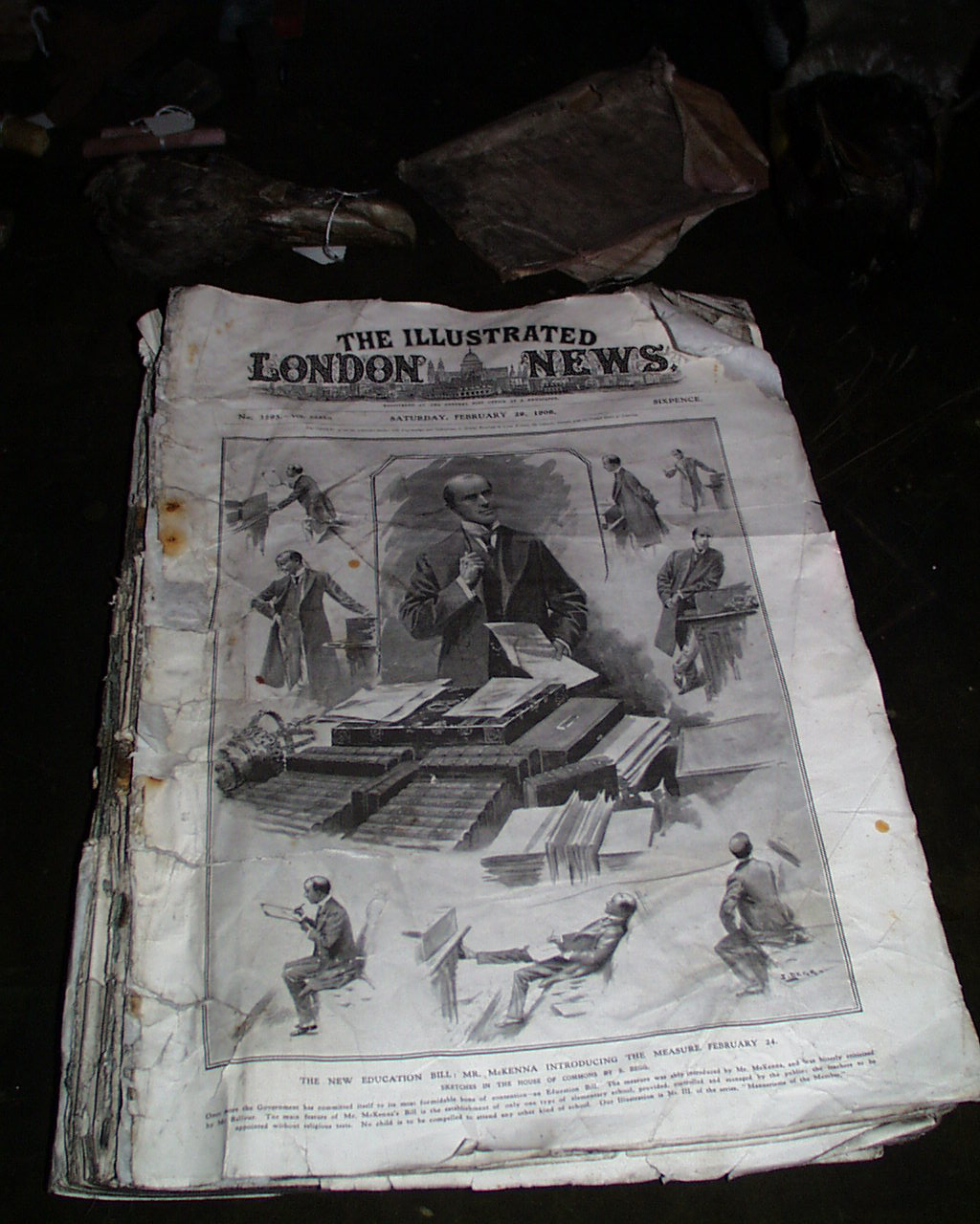 An old newspaper lies on a table.
