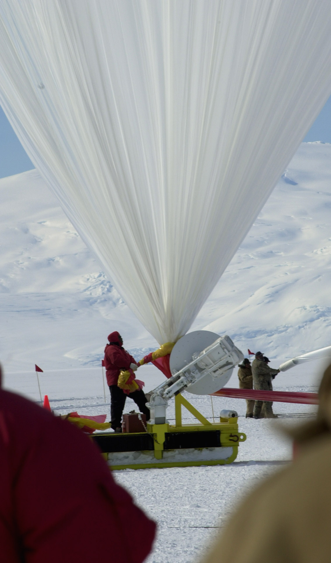 People inflate giant balloon.